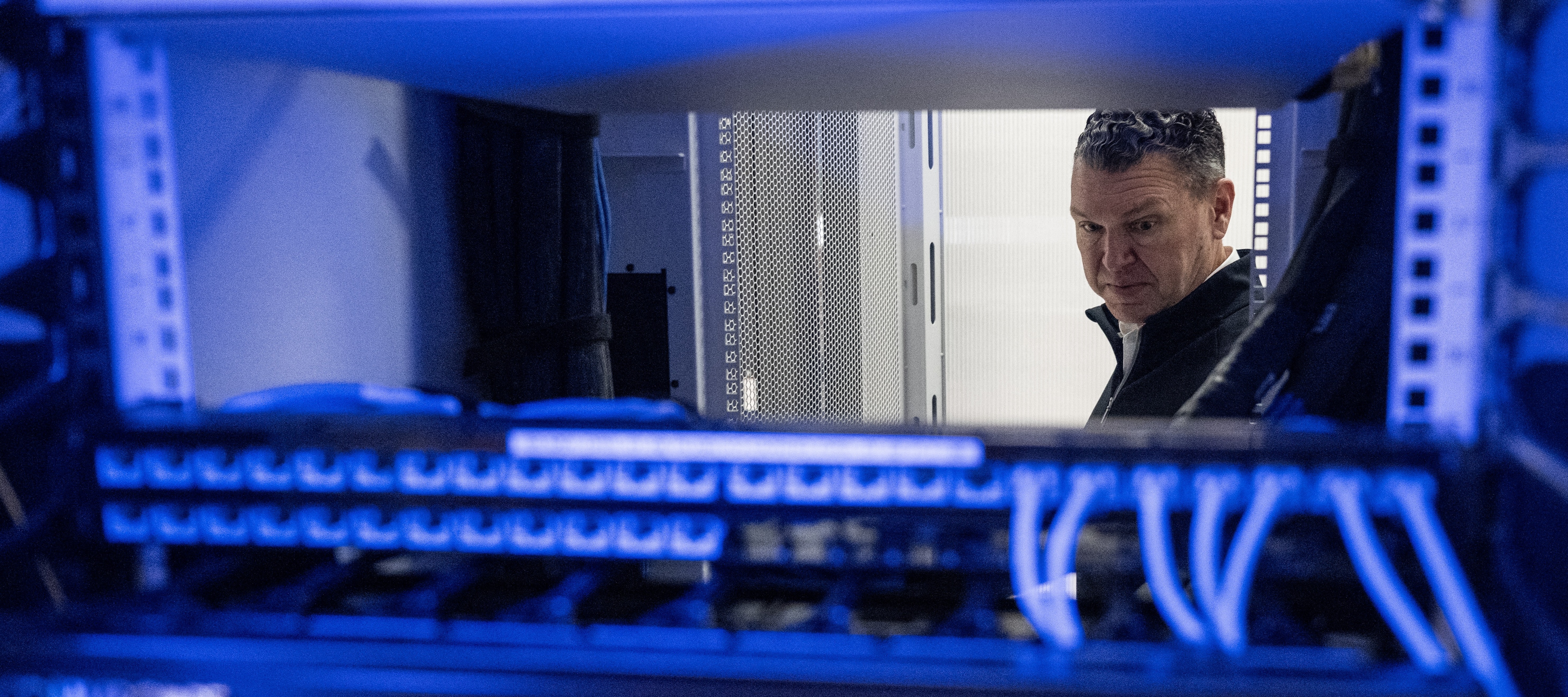 Chris Sharp, Chief Technology Officer of Digital Realty, looks at active servers in the Digital Realty Innovation Lab (DRIL) data center in Ashburn, Virginia.