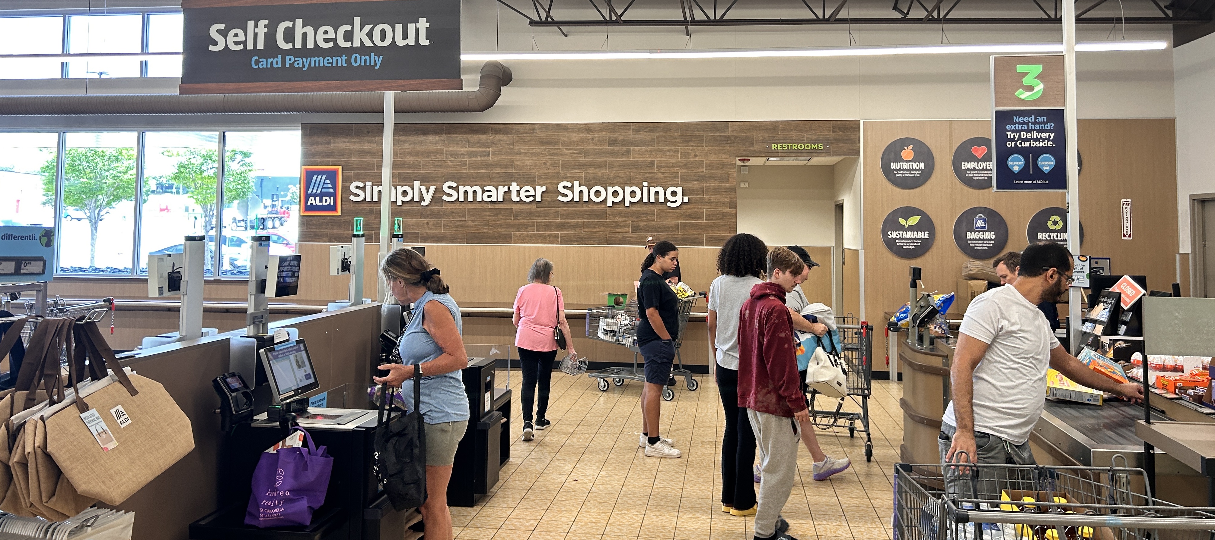 Customers use self-checkout machines at an Aldi store in Charlotte, North Carolina.