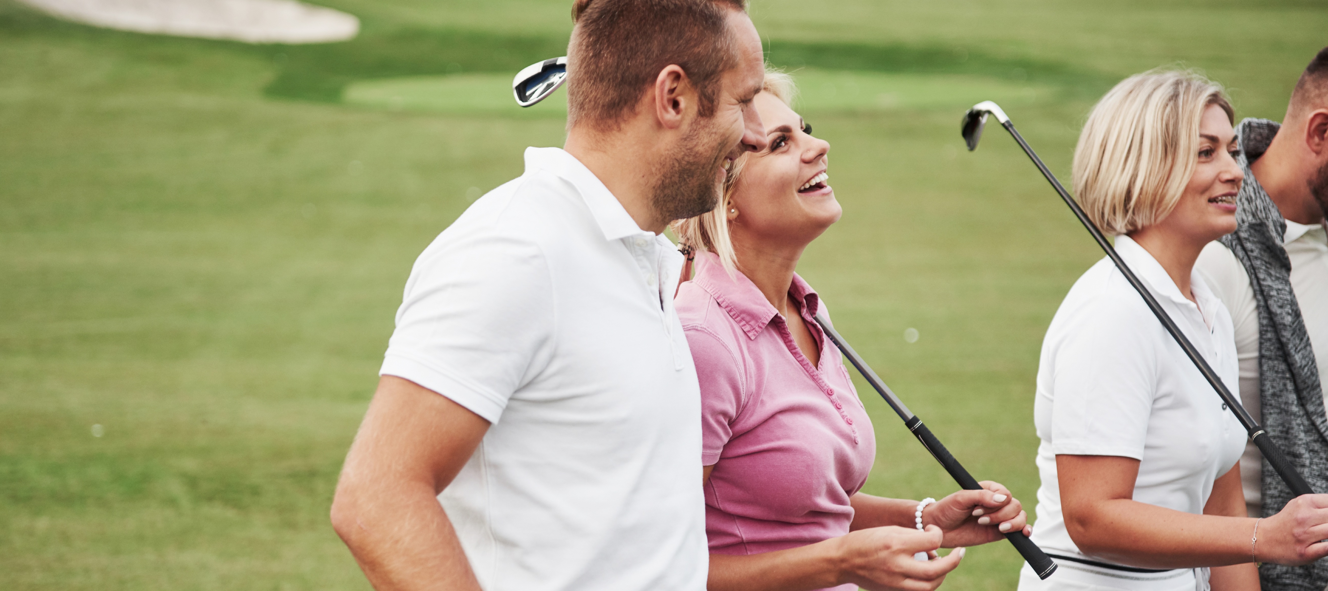 Two young couple on a golf course