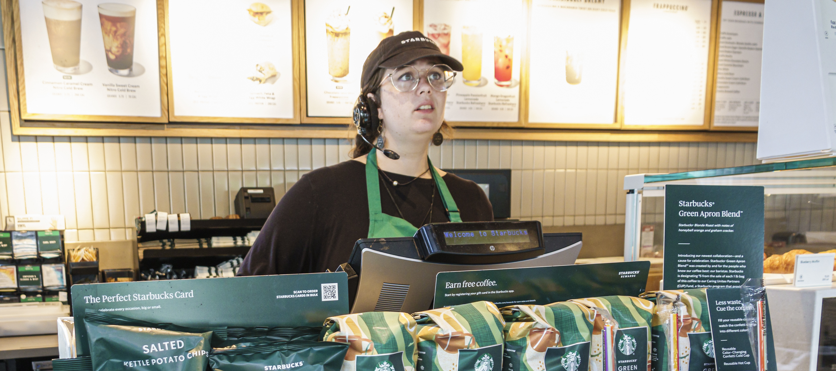 A Starbucks barista with a headset at a cashier in Augusta, Georgia.