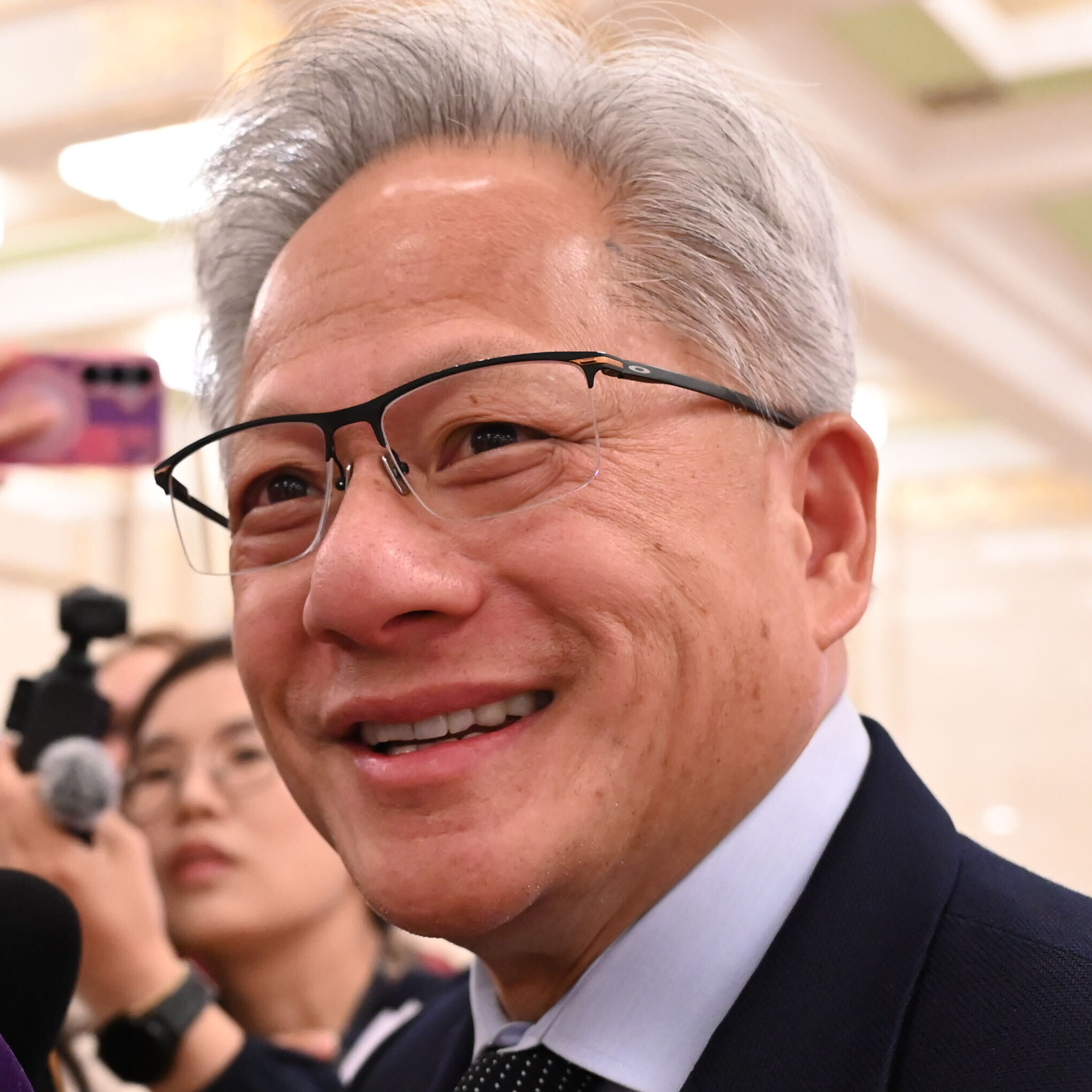Jensen Huang, seen here accompanying President Trump on his visit to China, recently told Carnegie Mellon grads that jobs in the trades are in demand.