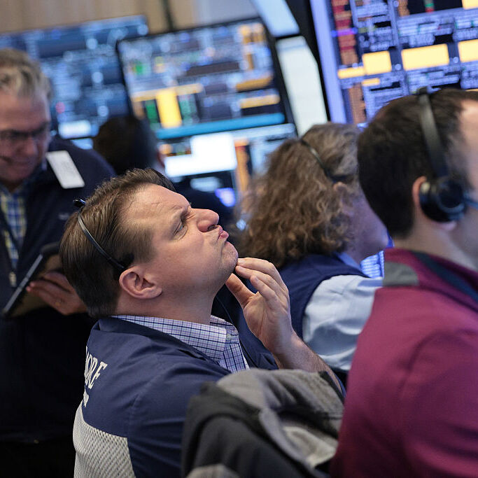 Traders work on the floor of the New York Stock Exchange during morning trading.