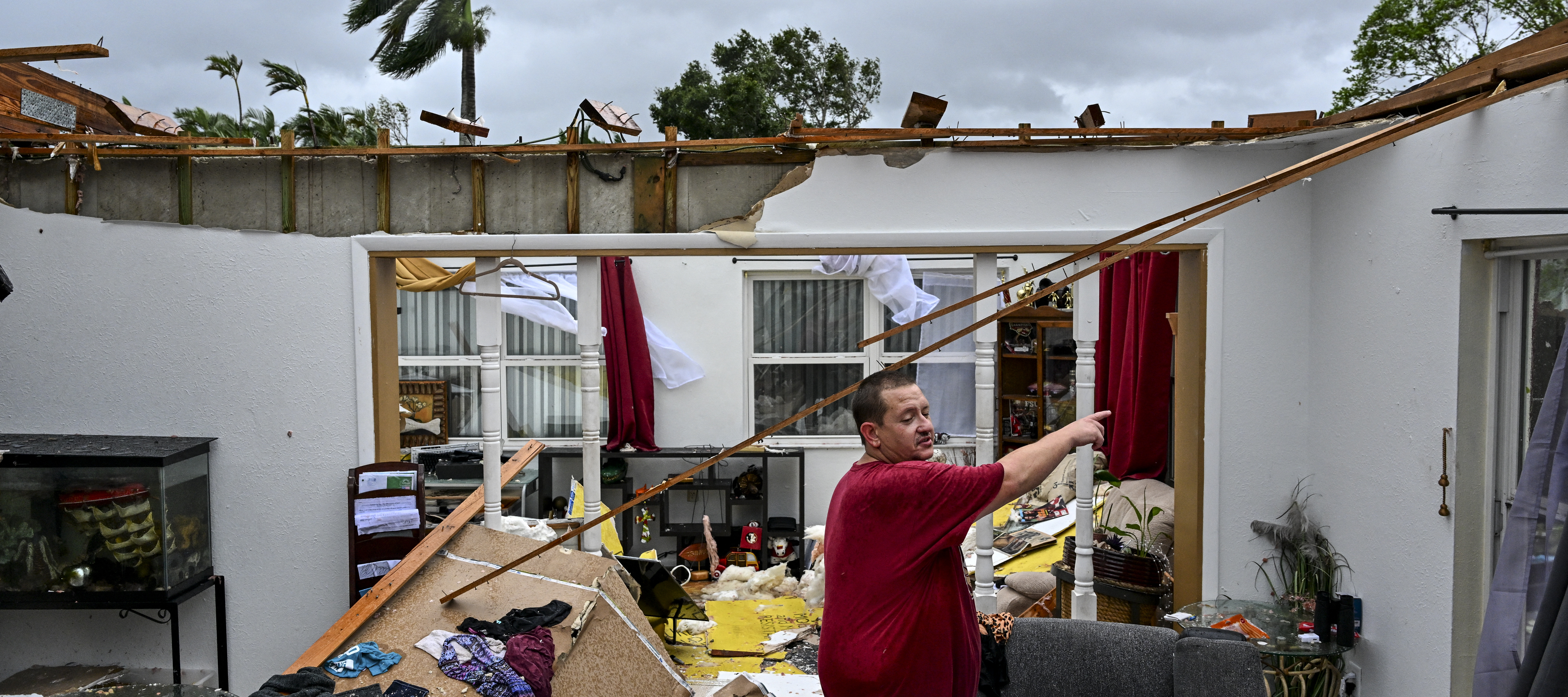 Robert Haight looks around his destroyed house after it was hit by a tornado in Fort Myers, Florida as Hurricane Milton approaches.