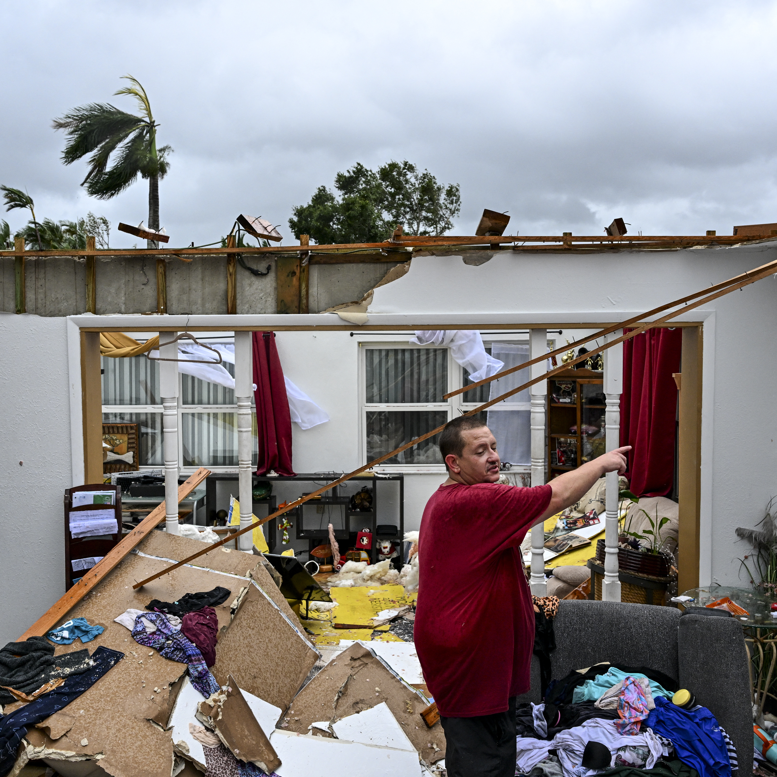 Robert Haight looks around his destroyed house after it was hit by a tornado in Fort Myers, Florida as Hurricane Milton approaches.