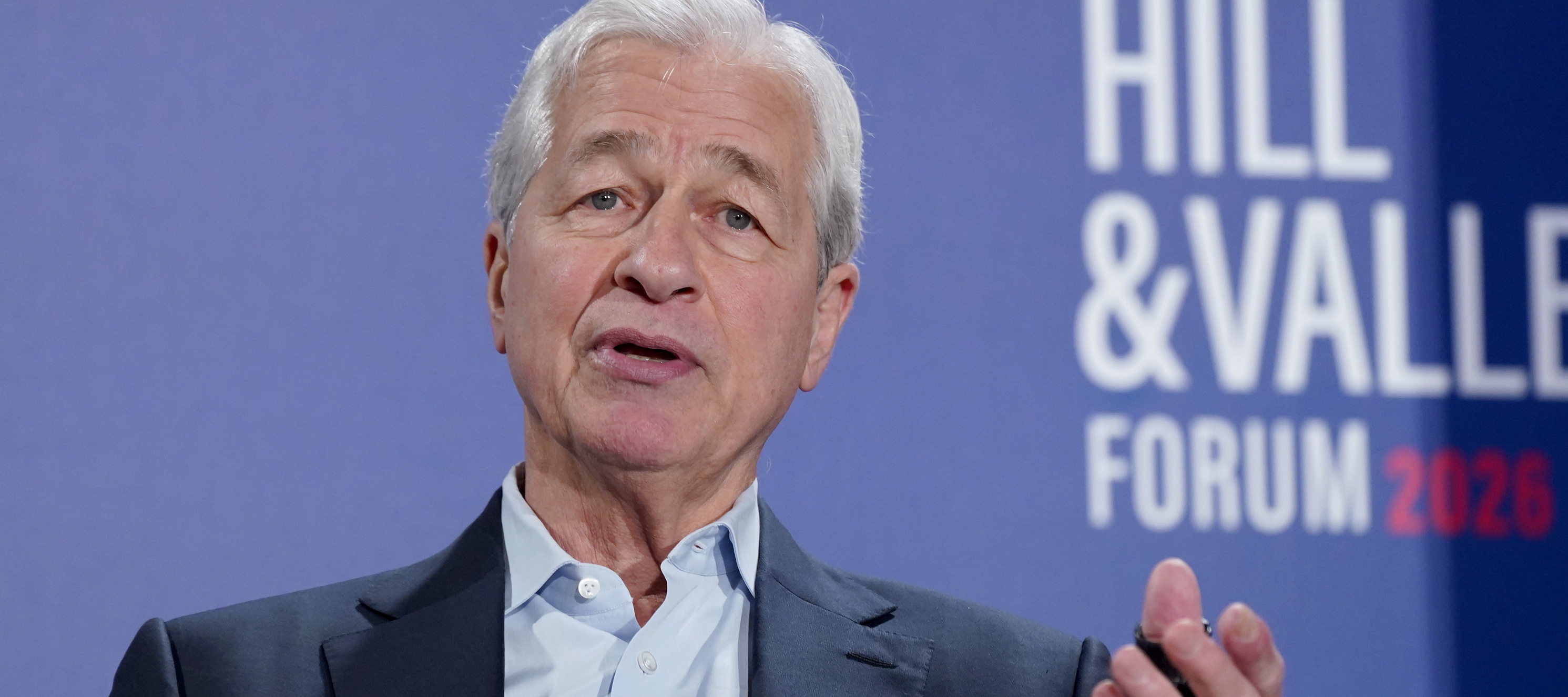 Jamie Dimon is taking a cautious market stance amid geopolitical risks, inflation, and an overhyped AI bubble.