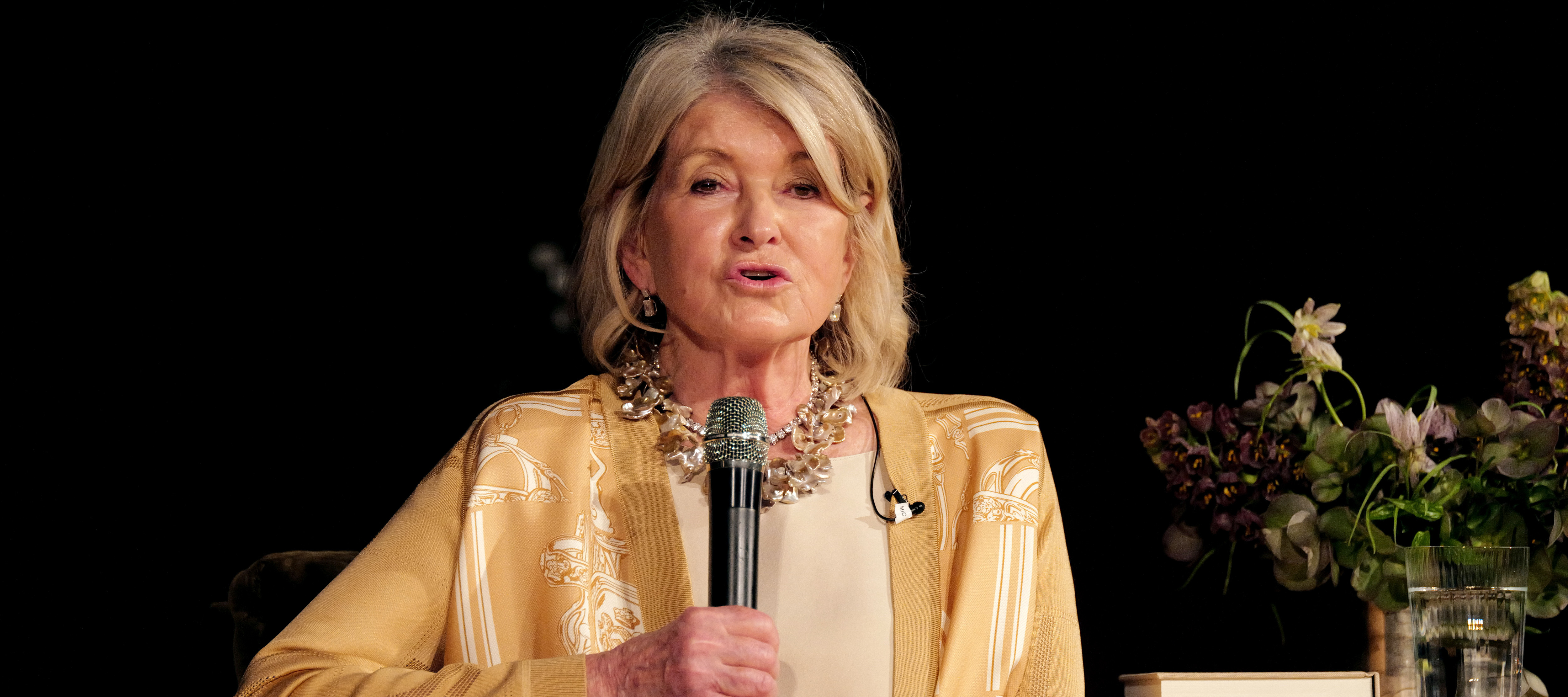 Martha Stewart holding a microphone during her recent book tour