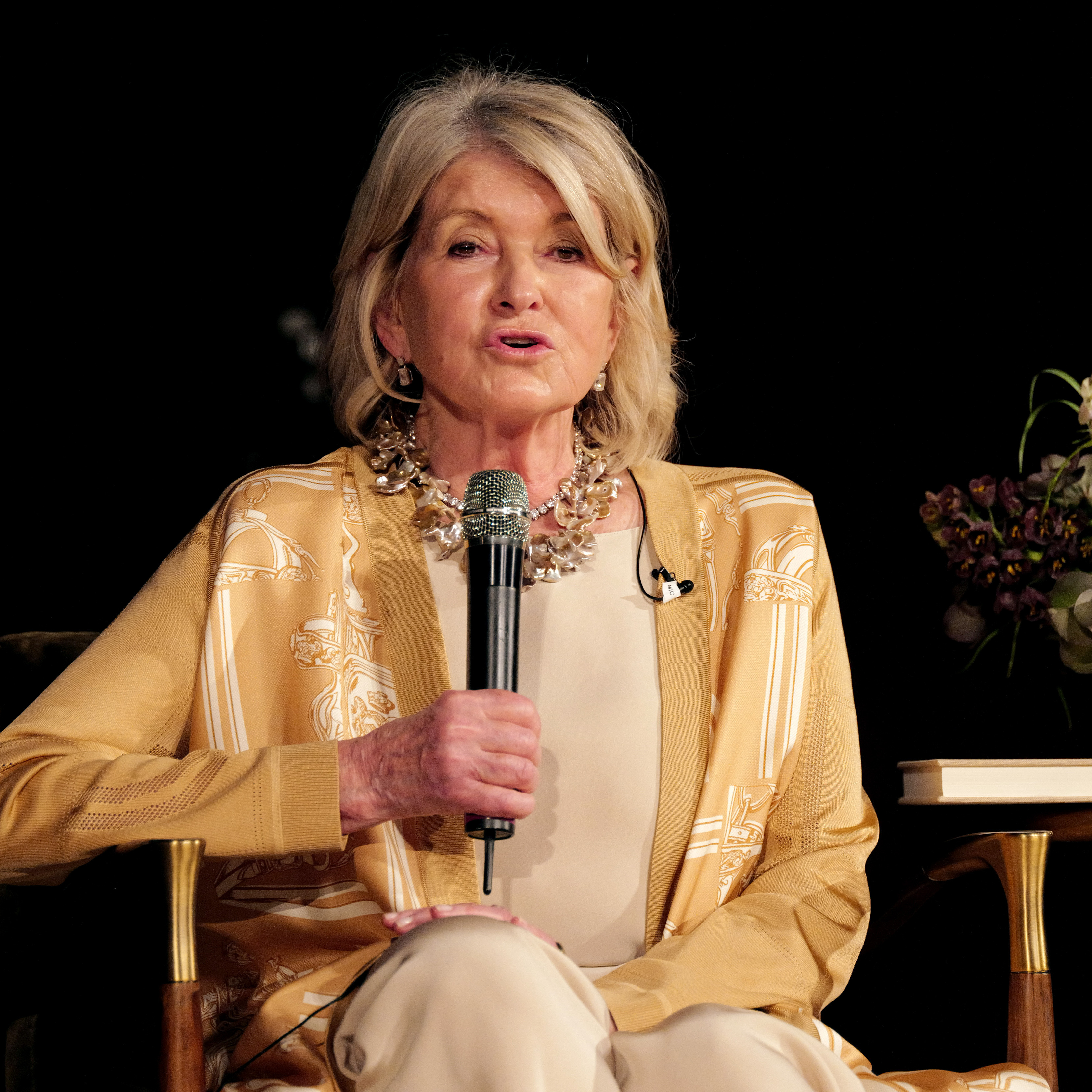 Martha Stewart holding a microphone during her recent book tour
