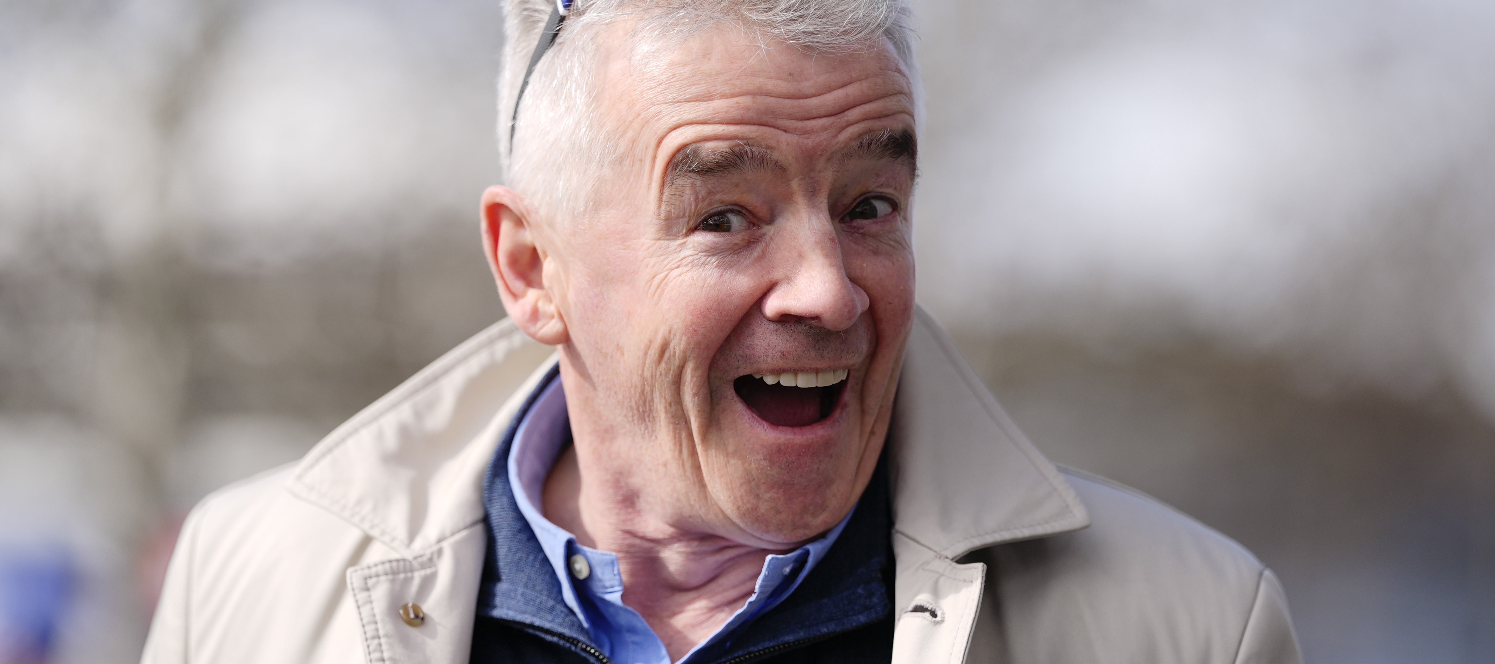 Ryanair CEO Michael O'Leary flashes a larger-than-life smile for the camera.