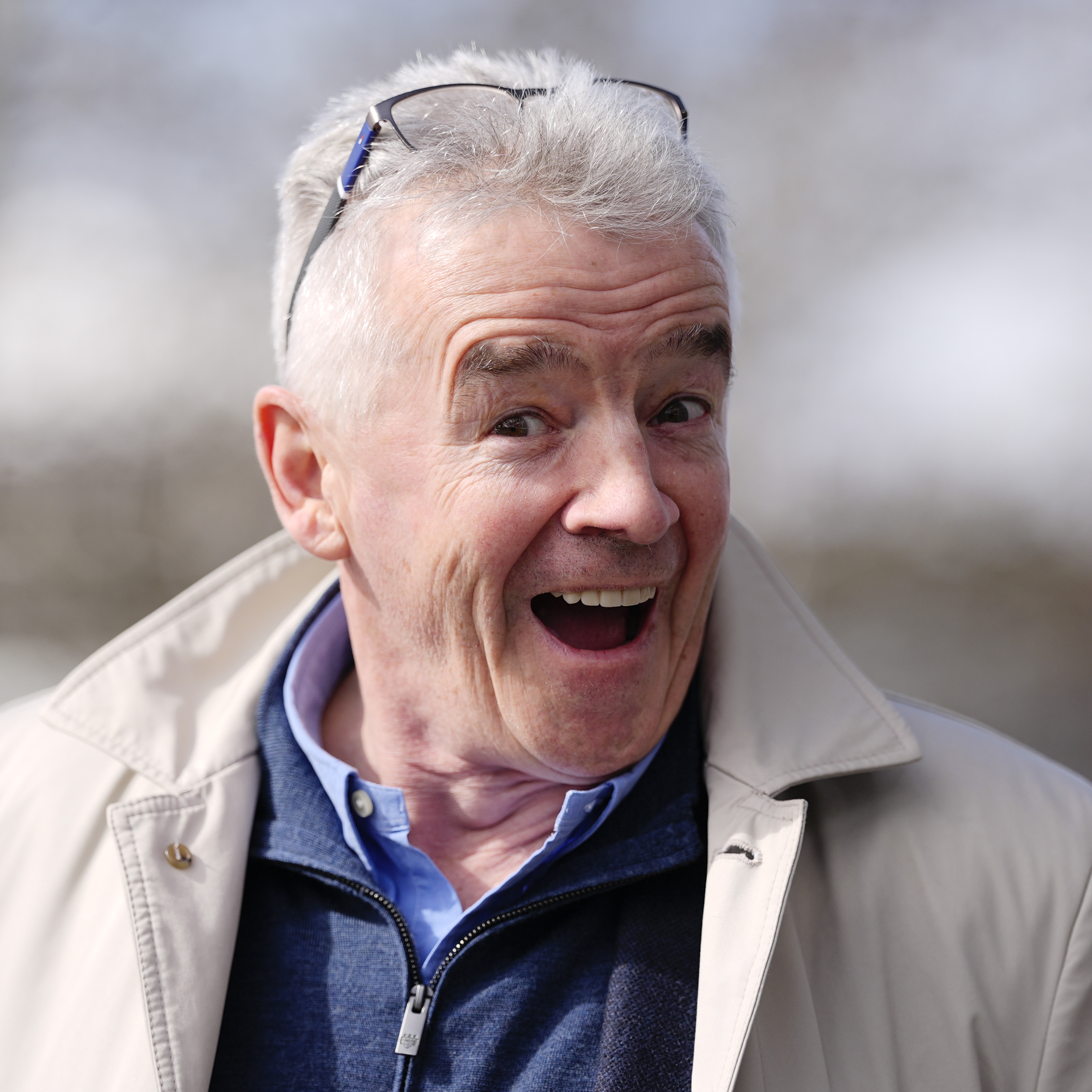 Ryanair CEO Michael O'Leary flashes a larger-than-life smile for the camera.