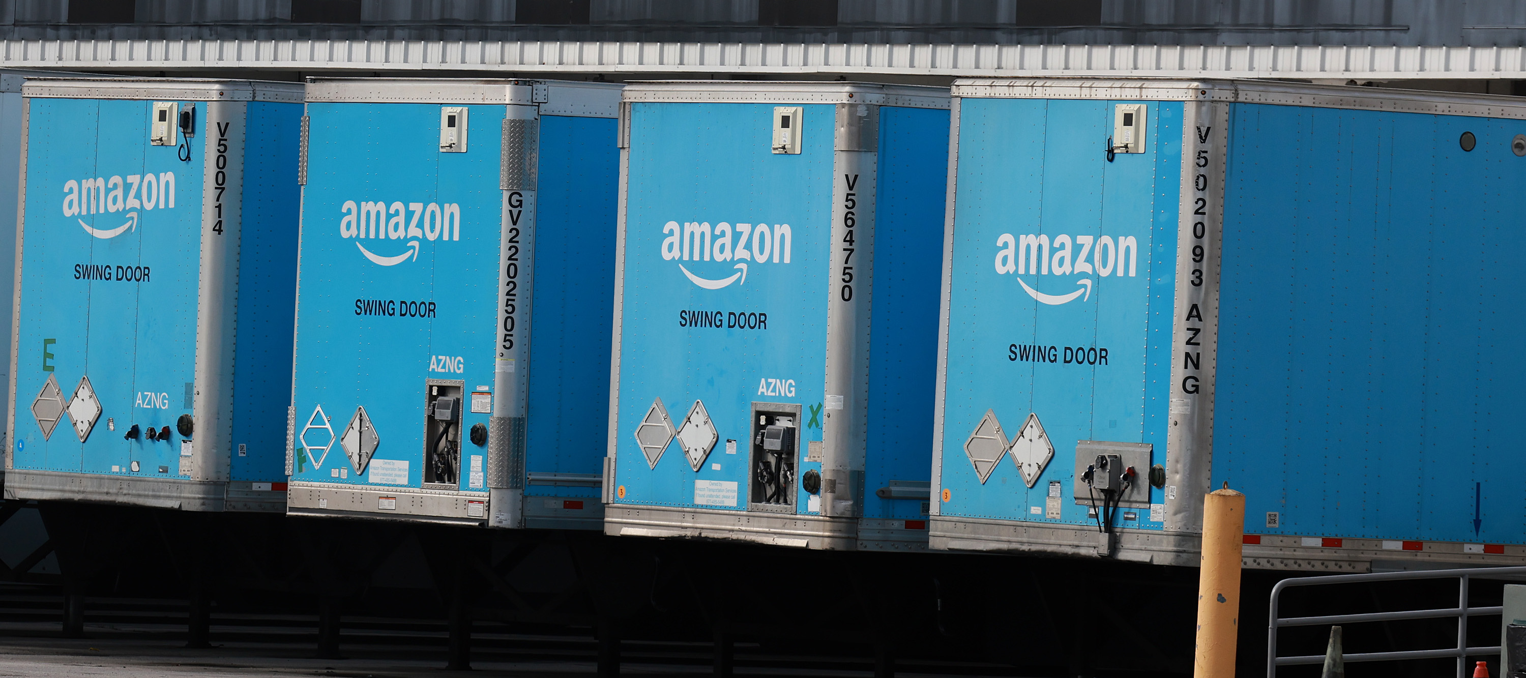 Large Amazon trucks parked in a row