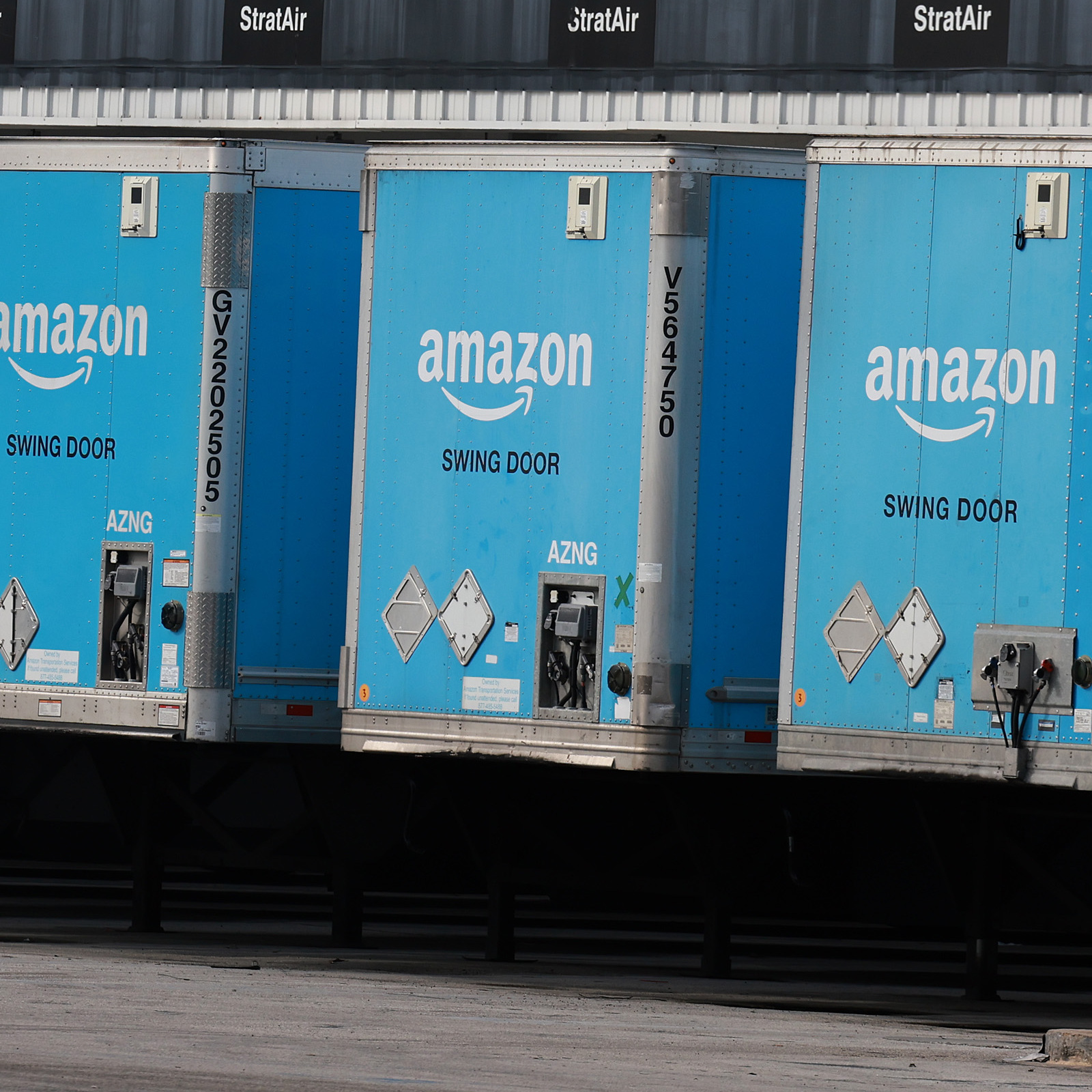 Large Amazon trucks parked in a row