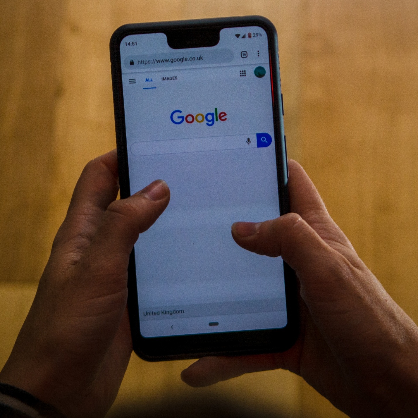 An image of a Google search bar and Google CEO Sundar Pichai speaking at Google I/O in May 2026.