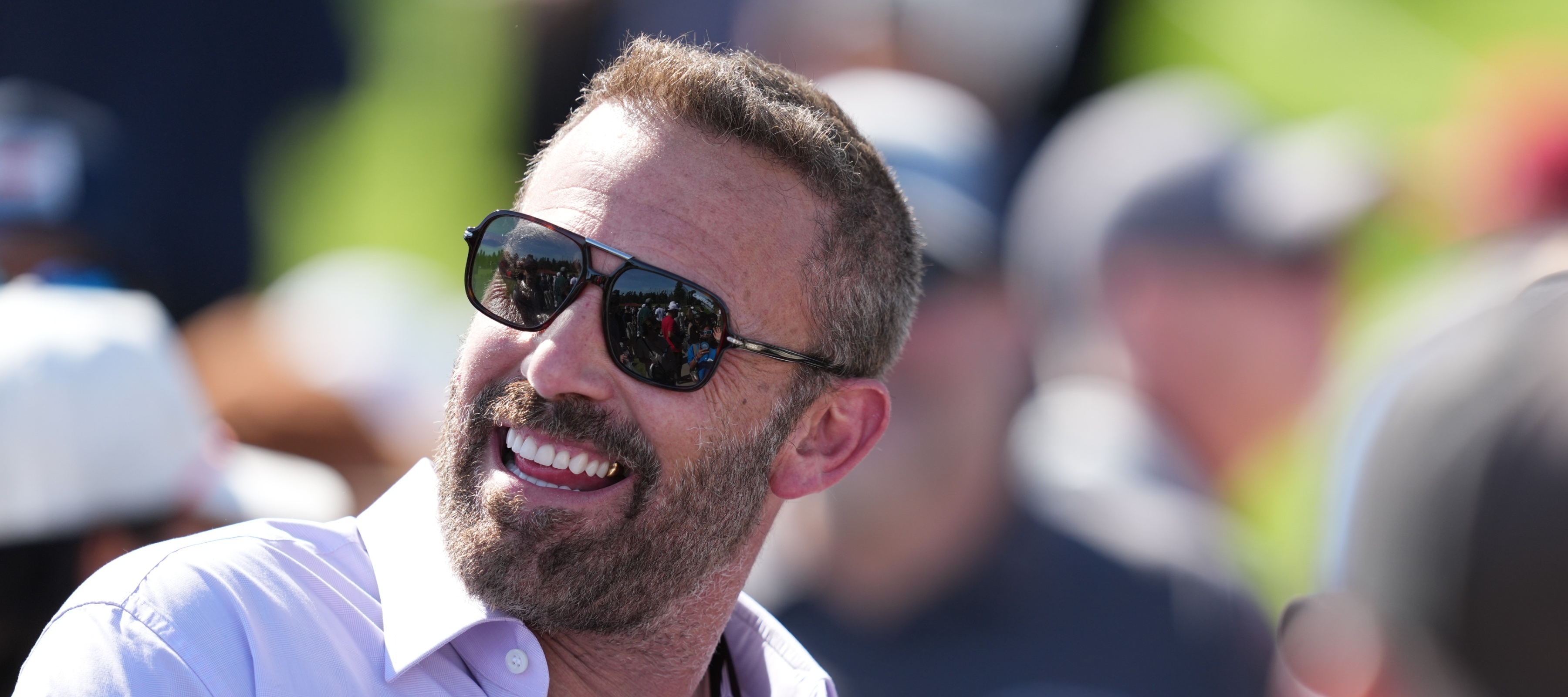 Ben Affleck smiles while donning a fresh pair of shades