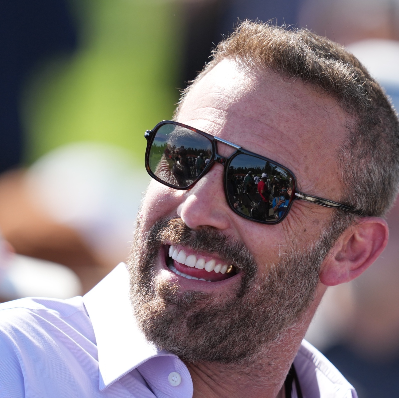 Ben Affleck smiles while donning a fresh pair of shades