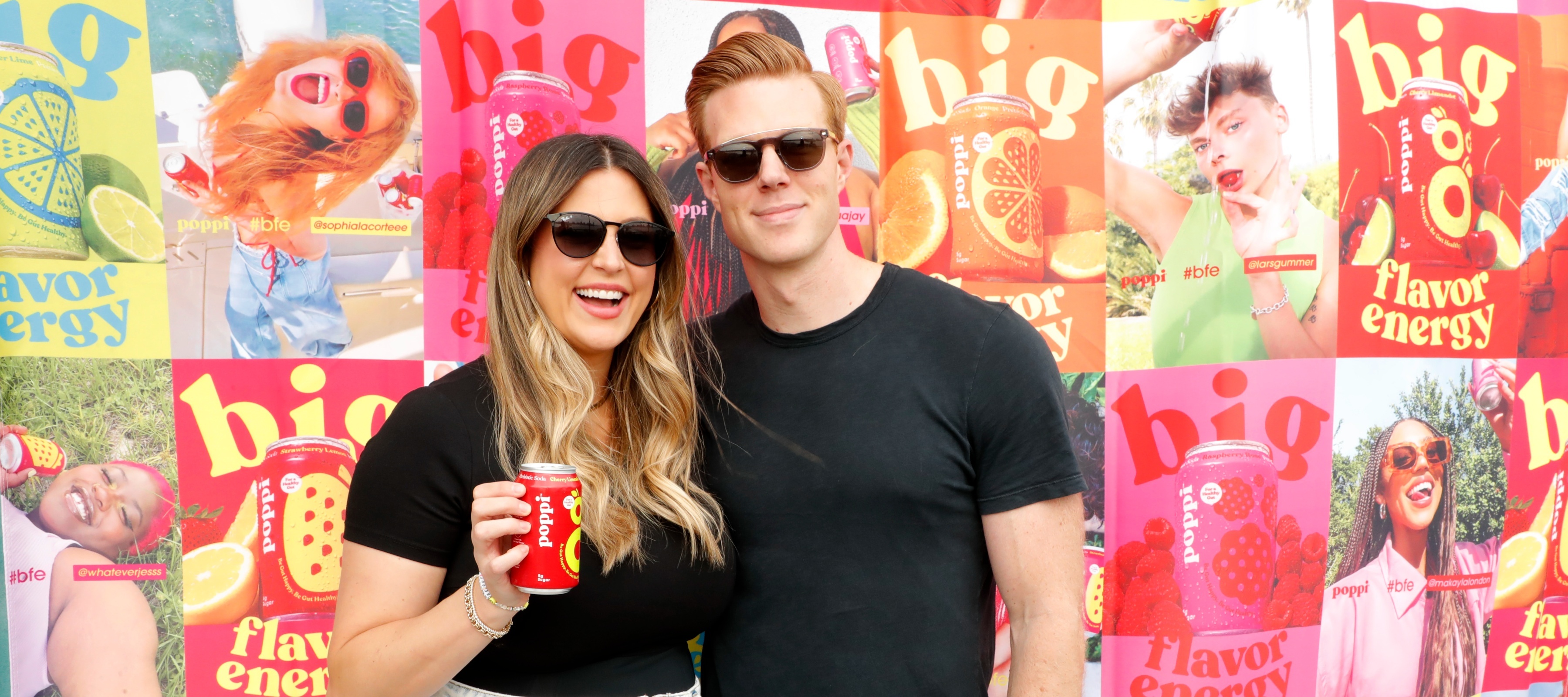 Allison Ellsworth, left, smiles while holding a can of Poppi next to her husband, Stephen