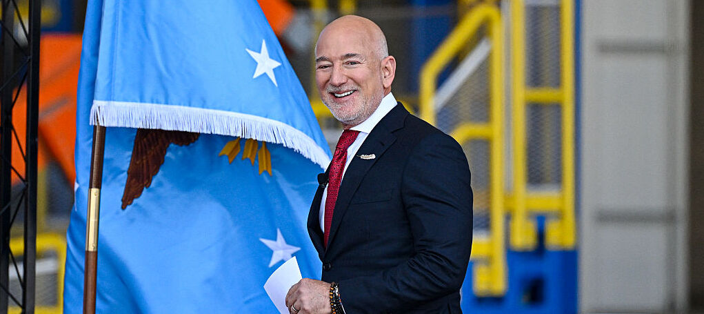 Blue Origin CEO Jeff Bezos arrives onstage ahead of US Defense Secretary Pete Hegseth at Blue Origin in Cape Canaveral, Florida, on February 2, 2026.