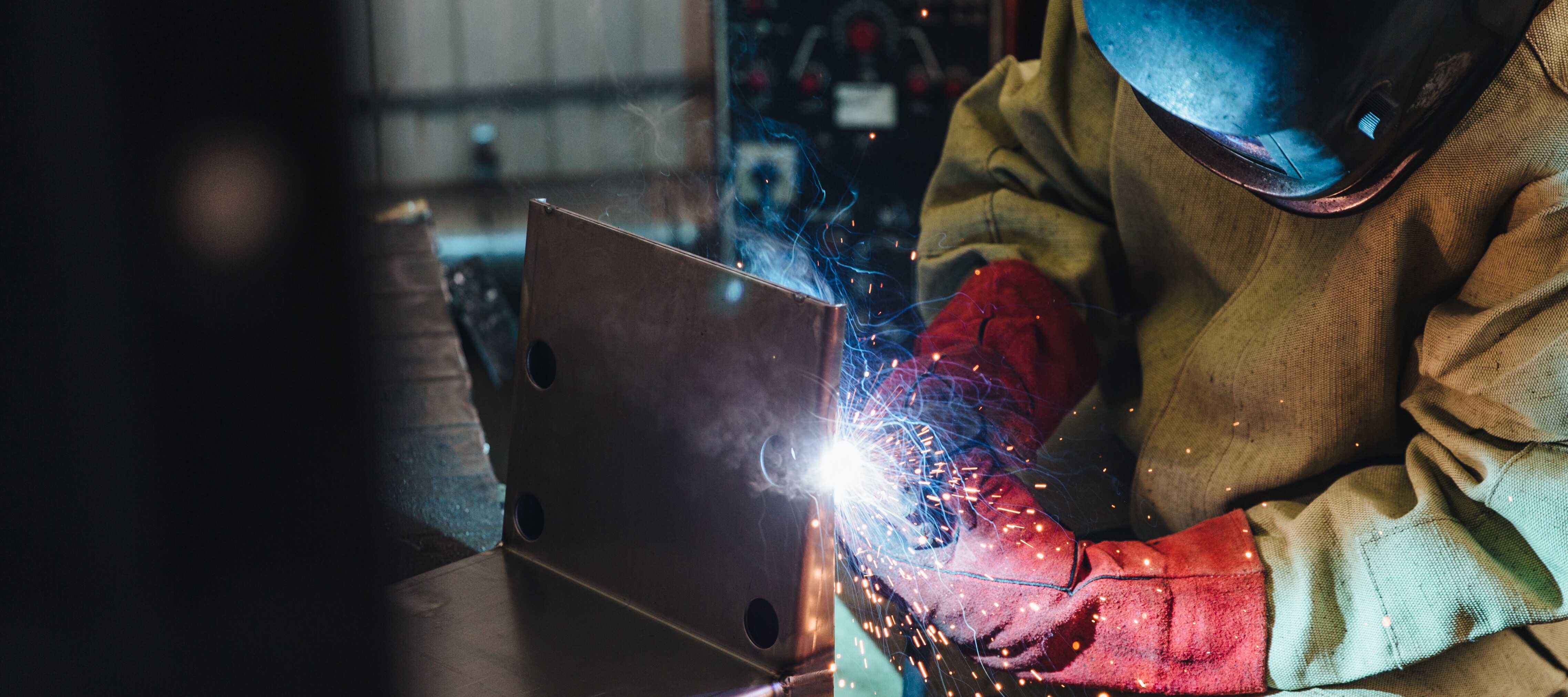 Welder working in shop