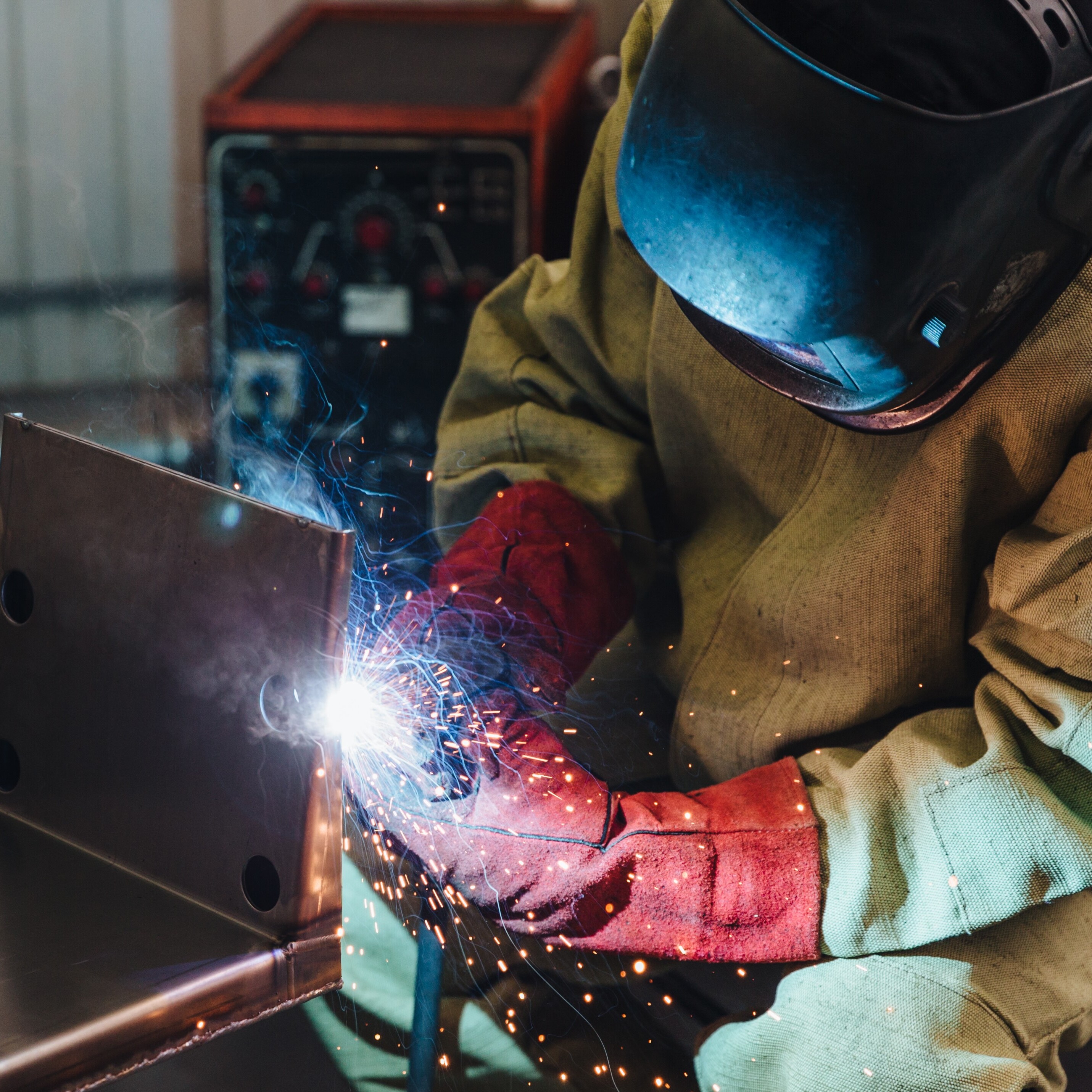 Welder working in shop
