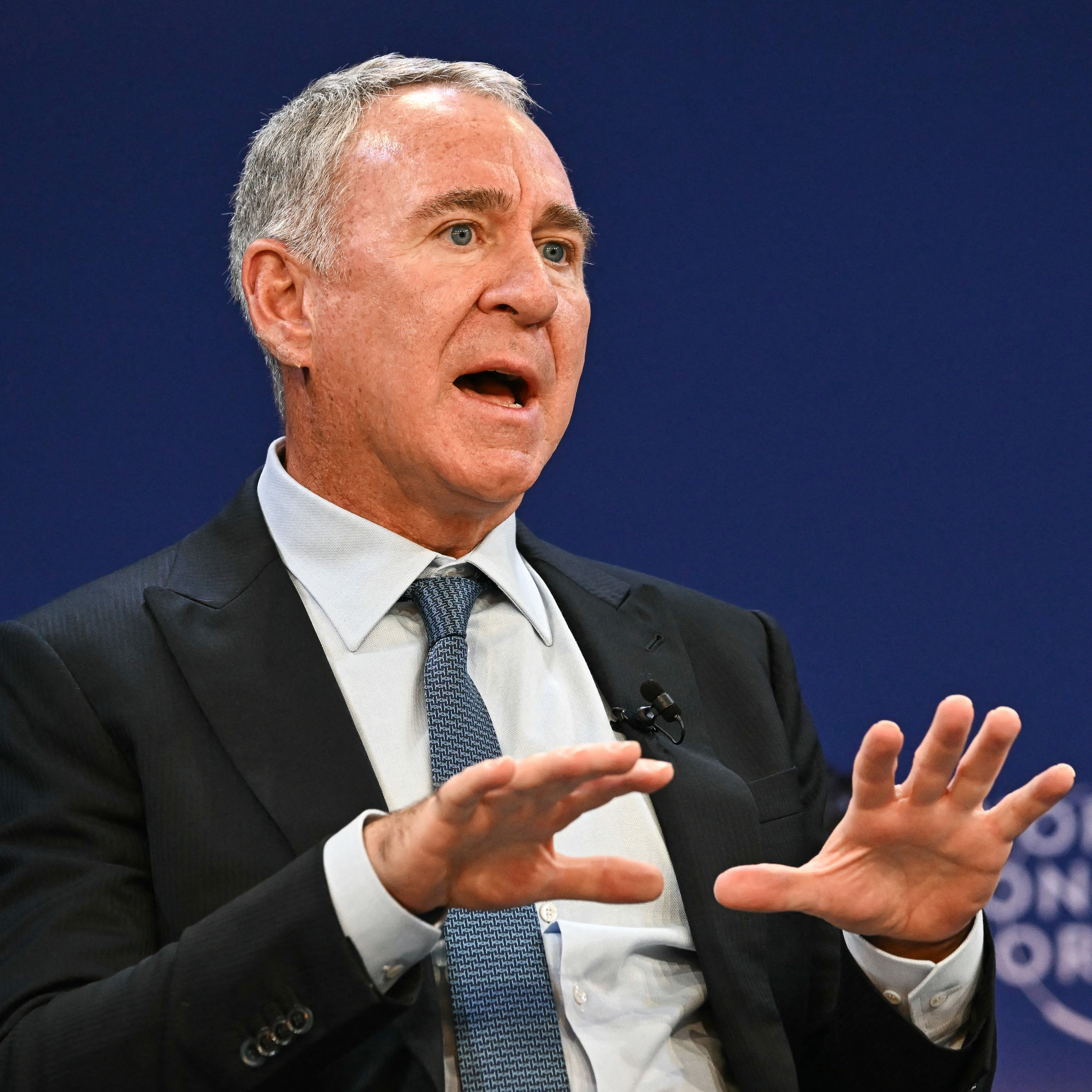 Founder and CEO of Citadel Ken Griffin gestures as he speaks on stage.