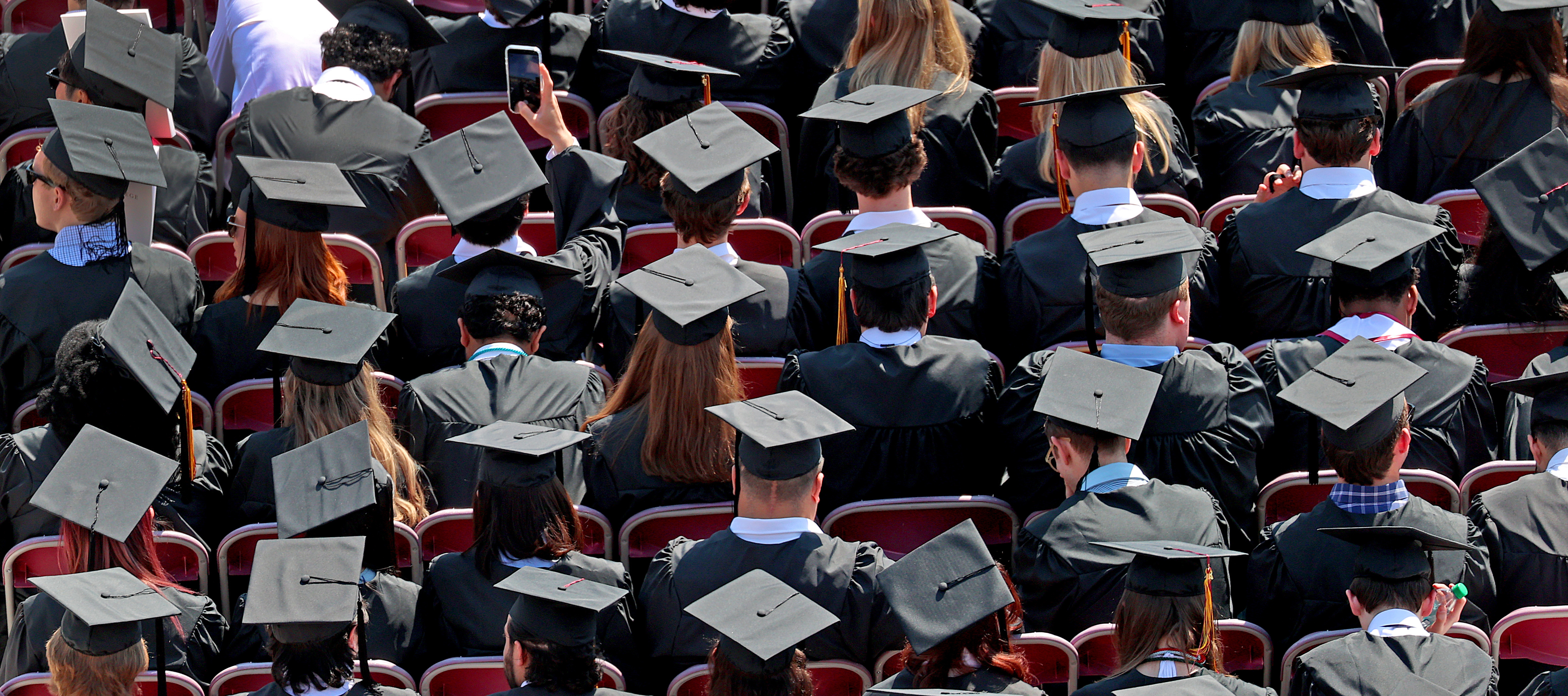 Sea of graduates at Boston College commencement ceremony.