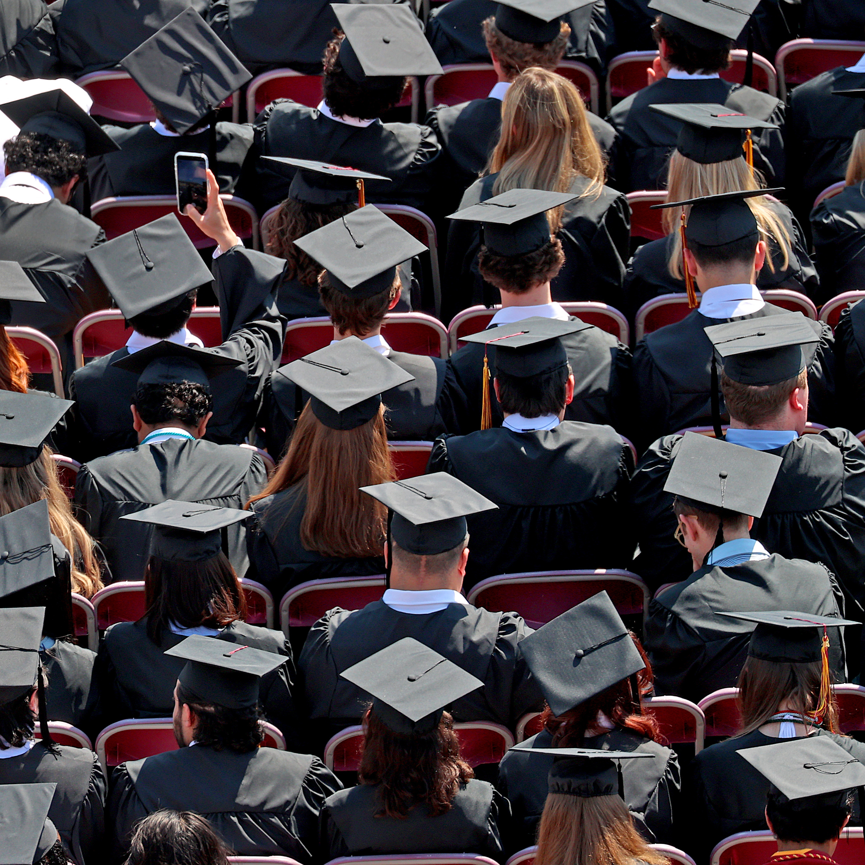 Sea of graduates at Boston College commencement ceremony.