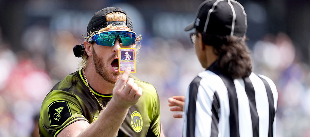 A photo of Logan Paul holding a Pokemon card