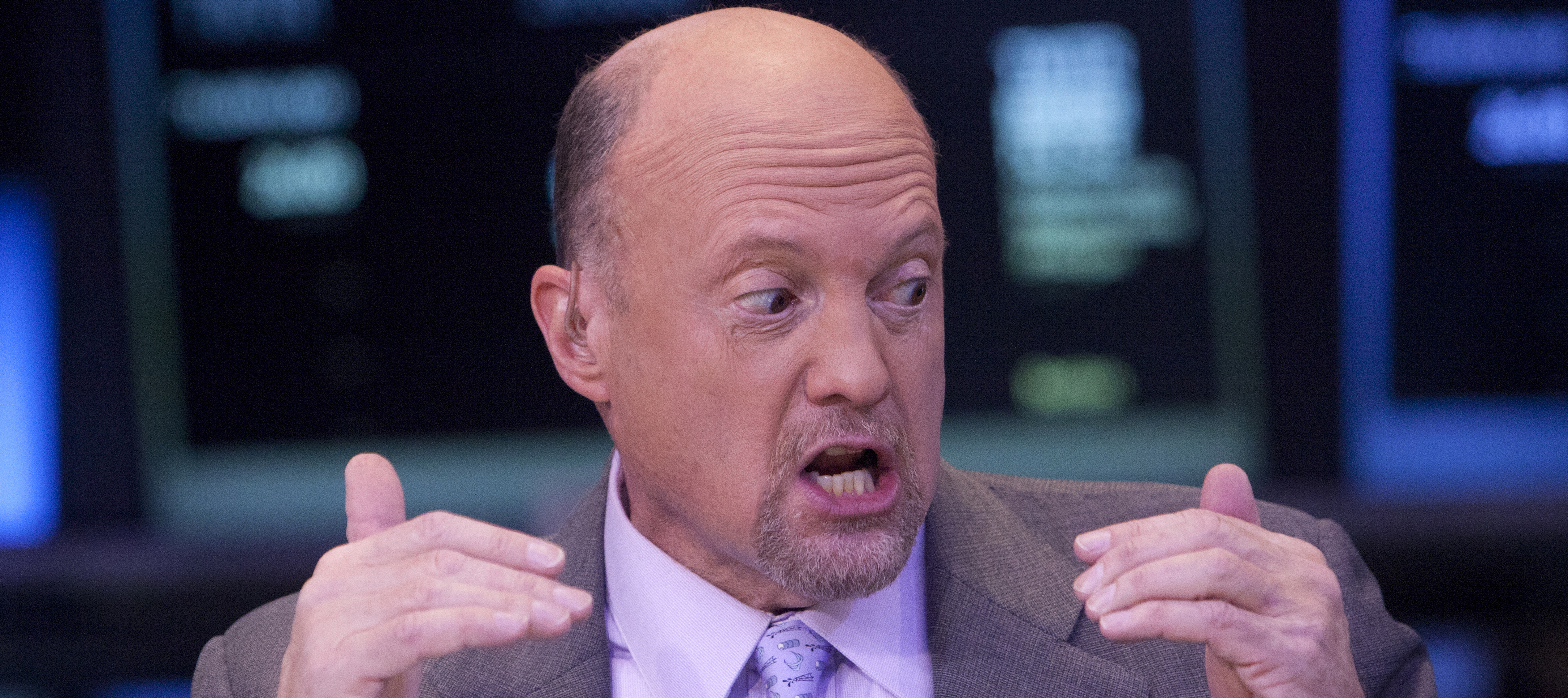 CNBC's Jim Cramer raises both hands and gesture in disbelief.