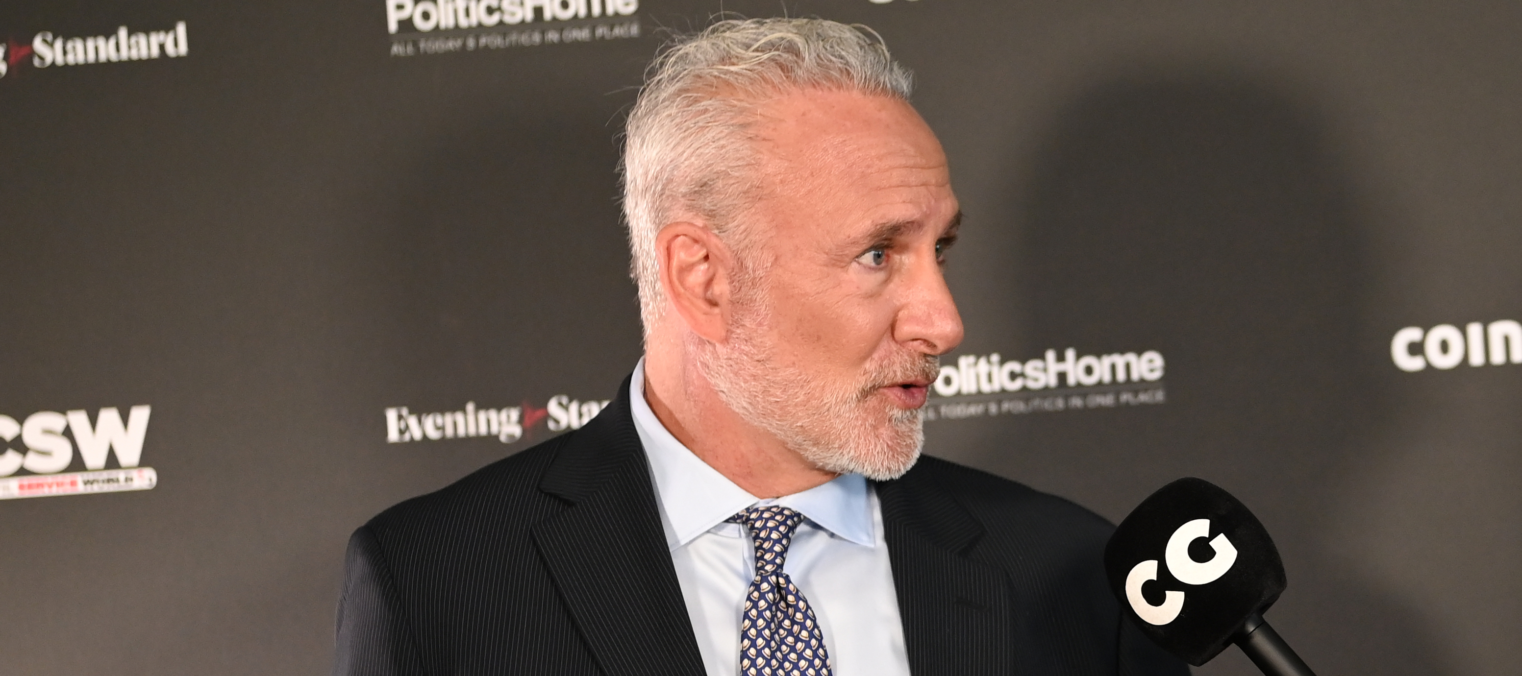 Peter Schiff spreads his hands in disbelief while being interviewed.