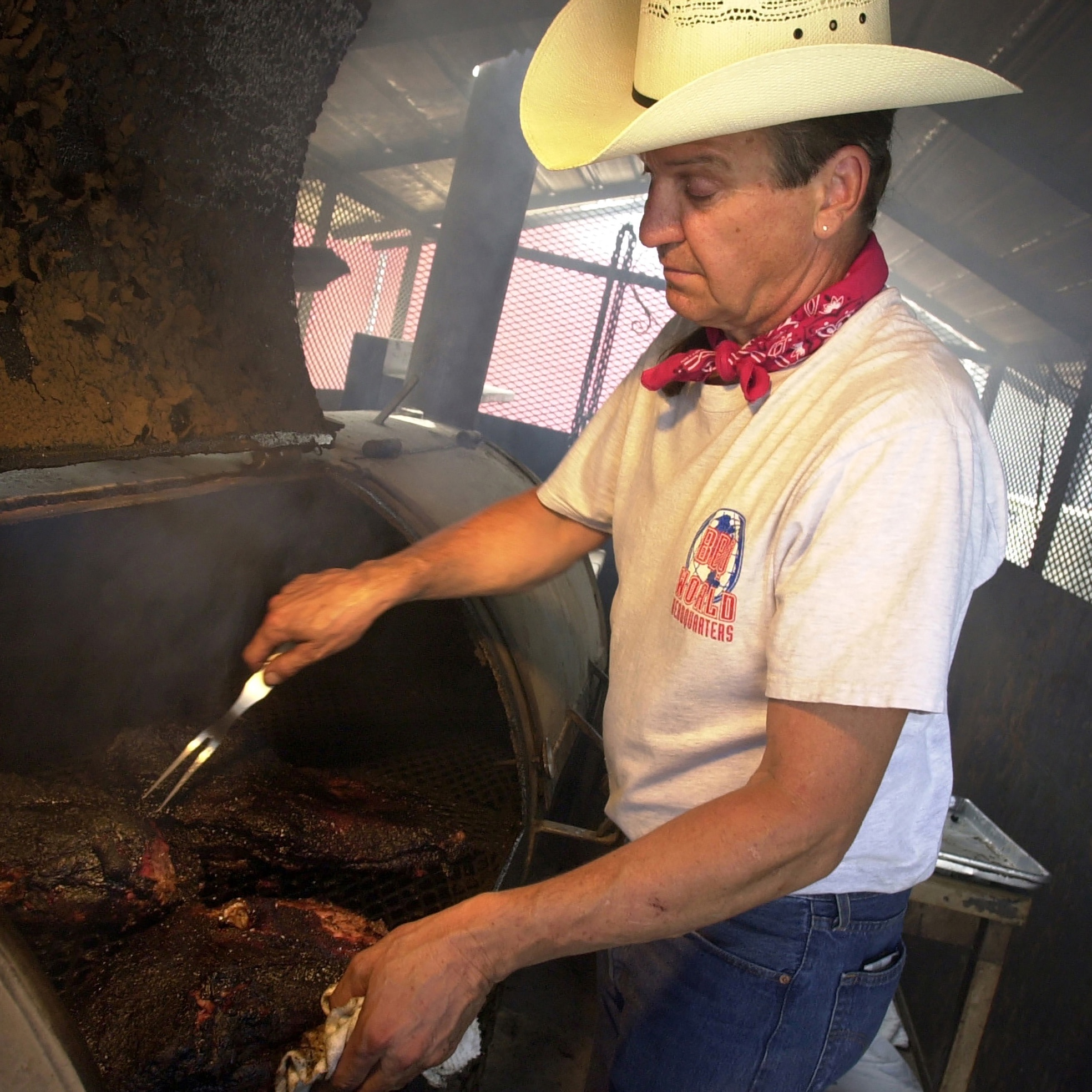 Barbecue pitmaster Duke Bischoff tends to brisket in Austin, Texas.