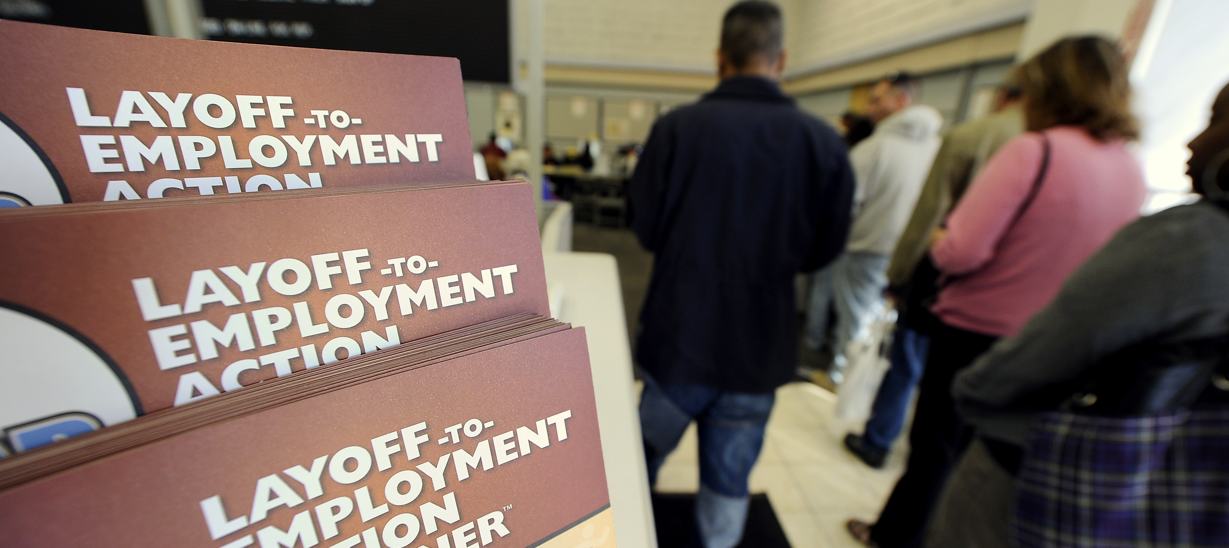Job-seekers wait in line for assistance at a government-run employment center, in Las Vegas, Nevada.