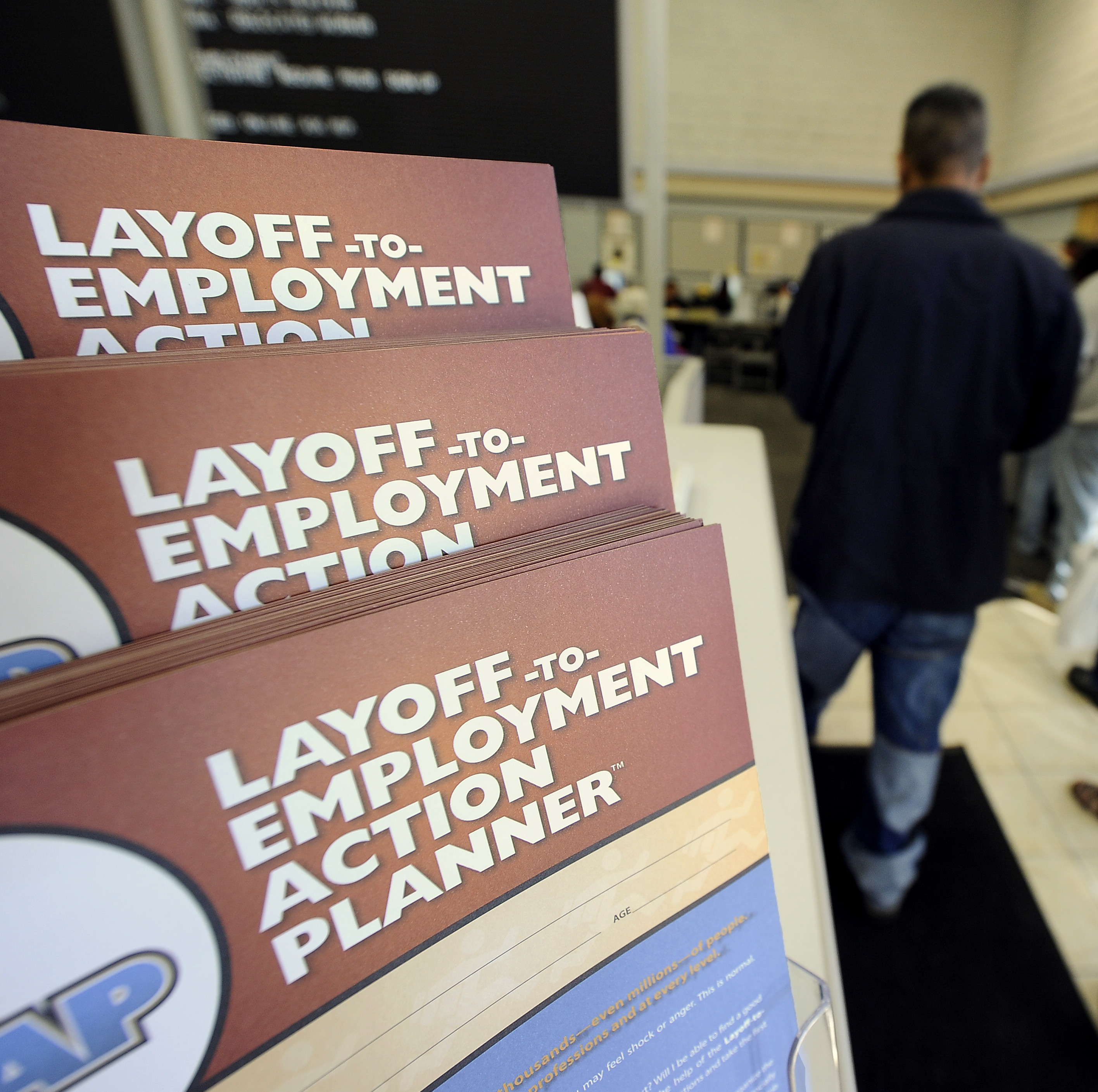 Job-seekers wait in line for assistance at a government-run employment center, in Las Vegas, Nevada.