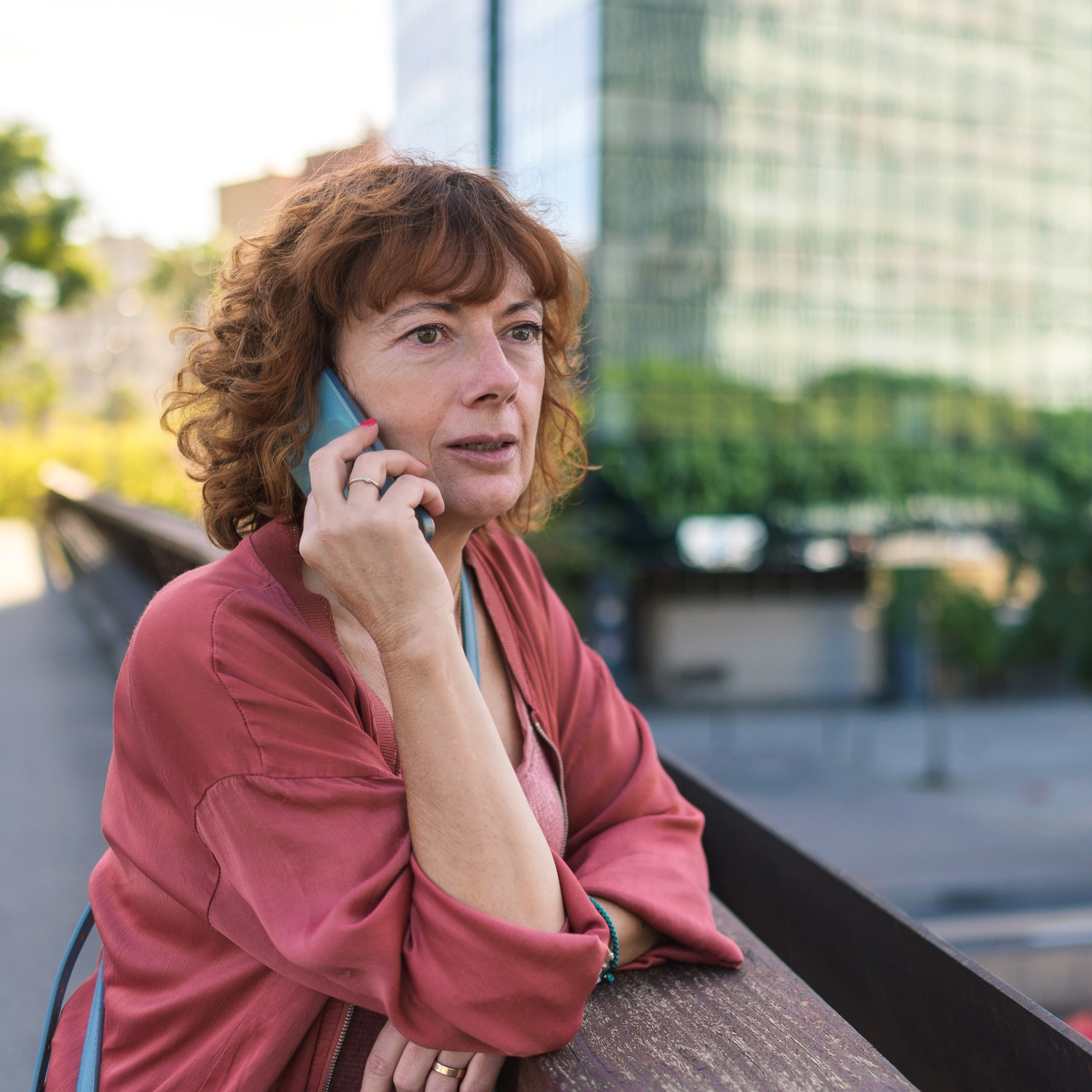 Woman talking on phone outside