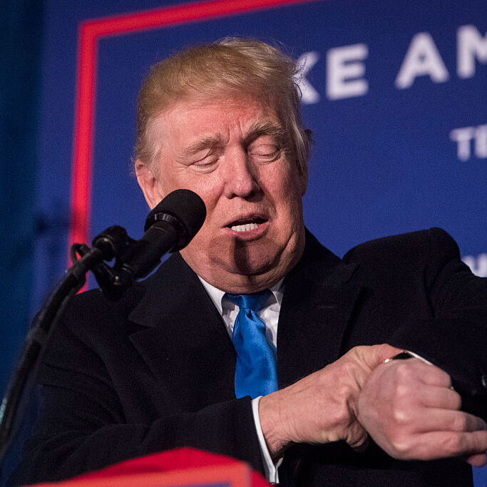 A photo of Donald Trump checking his watch