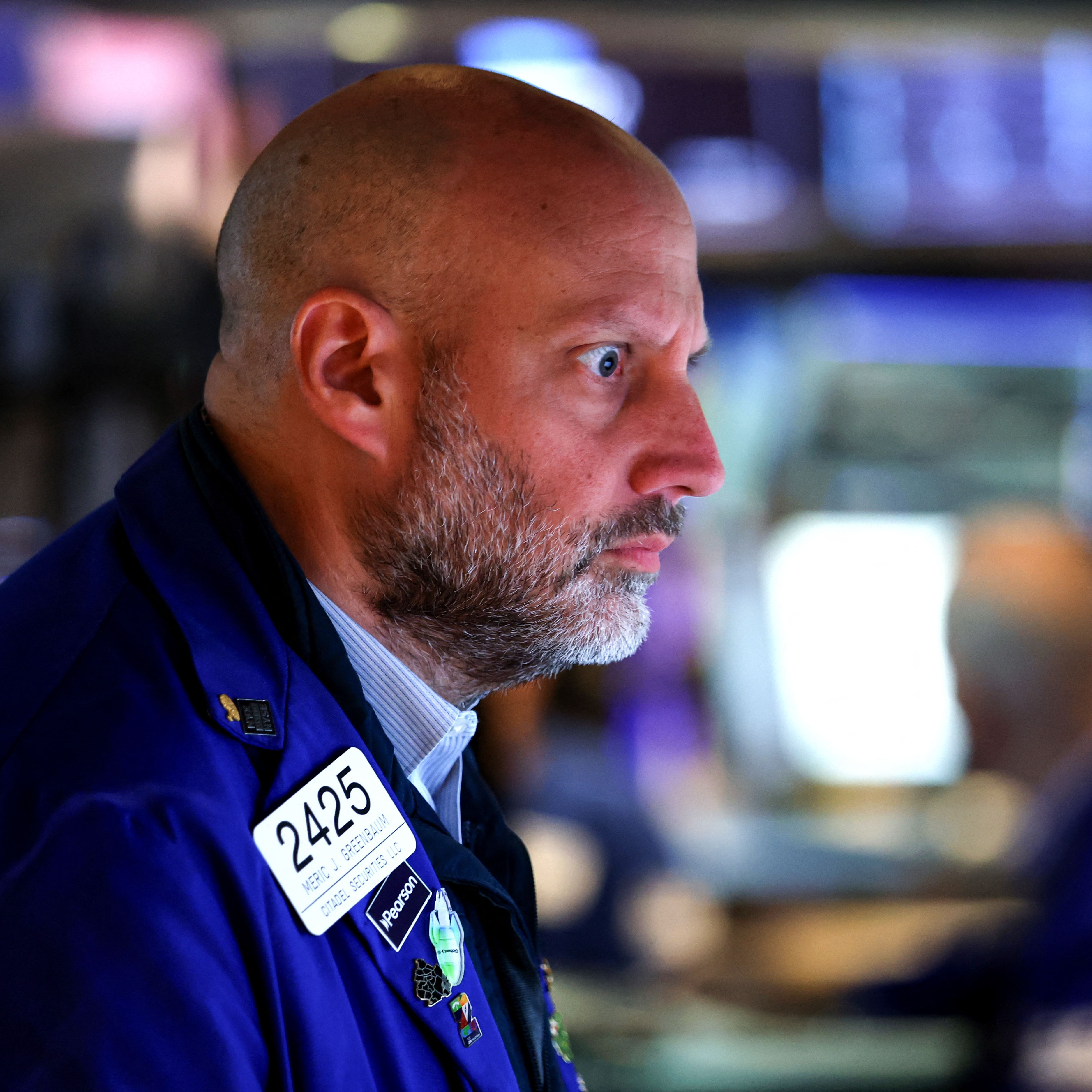 A trader works on the floor of the New York Stock Exchange (NYSE) following the opening bell in New York on April 16, 2026.