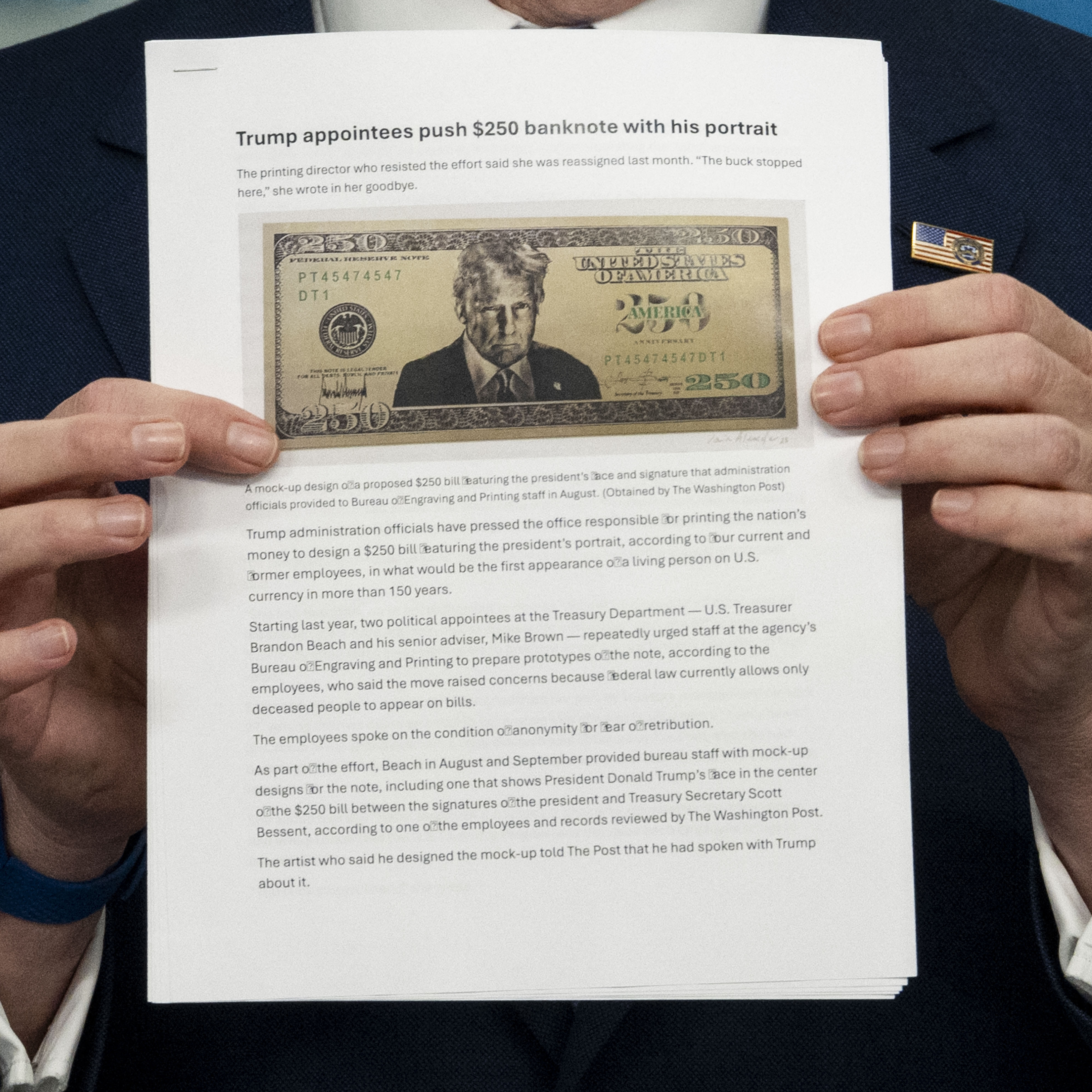 US Secretary of Treasury Scott Bessent shows a proposed $250 bill featuring President Donald Trump.