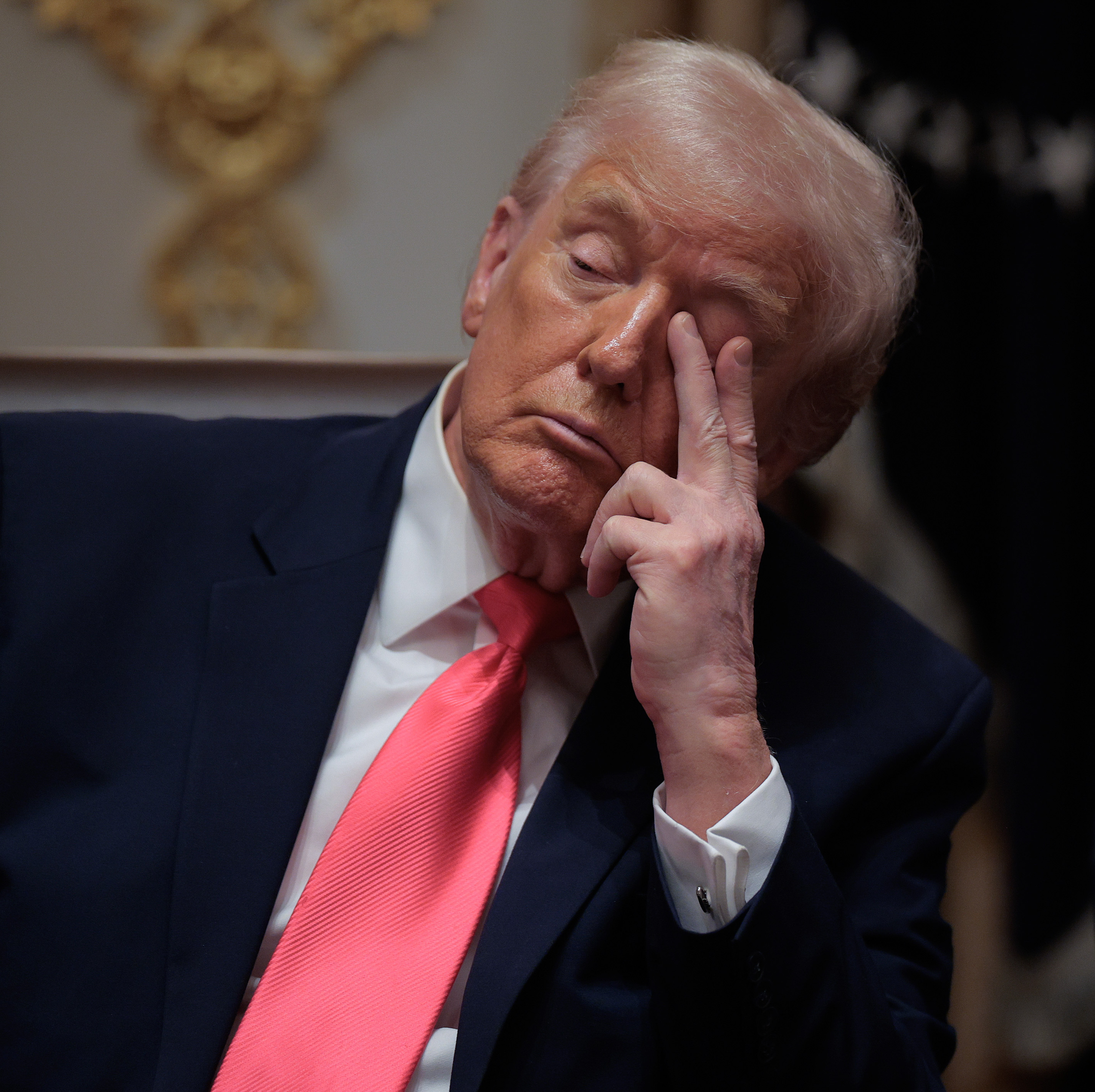 Trump attends a meeting of his Cabinet in the Cabinet Room of the White House.