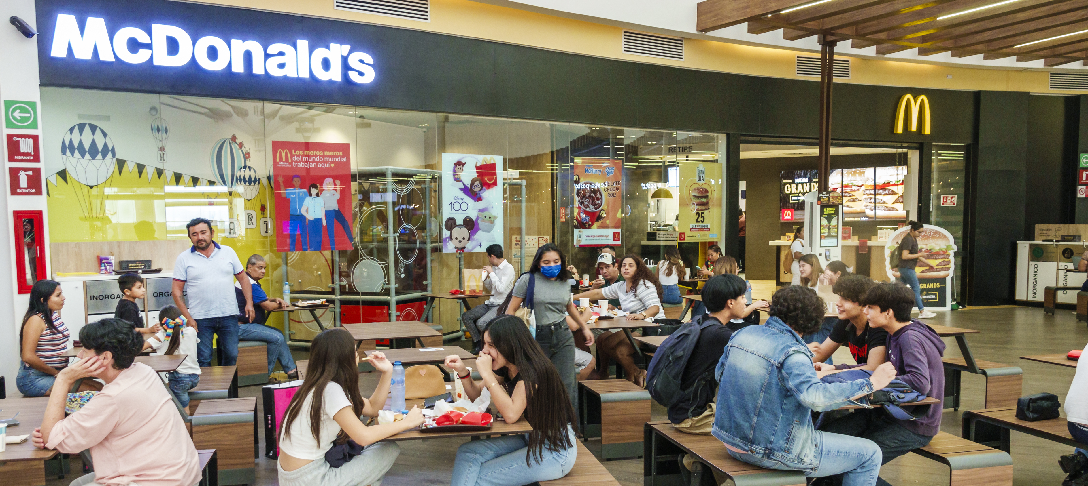 The interior of a McDonald's restaurant inside of a mall.