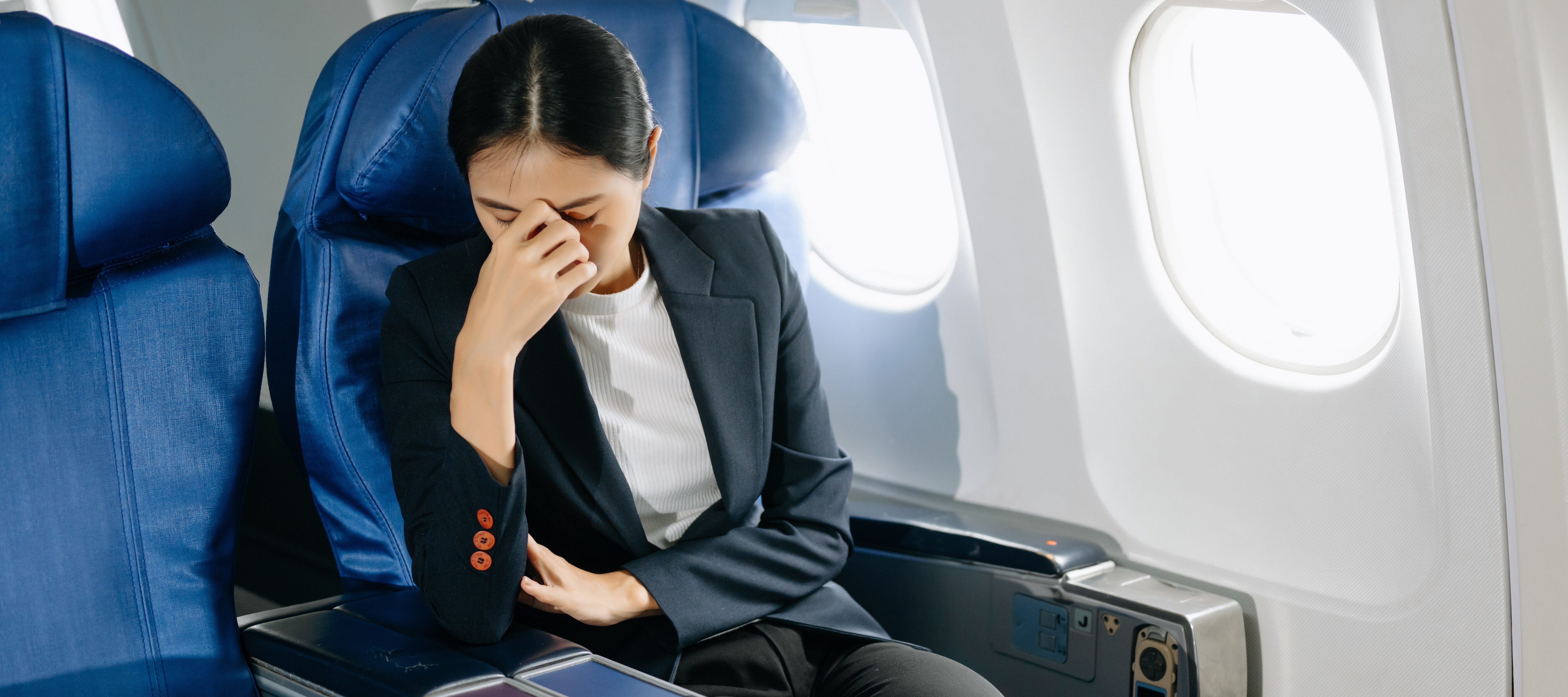 Disgruntled woman on airplane