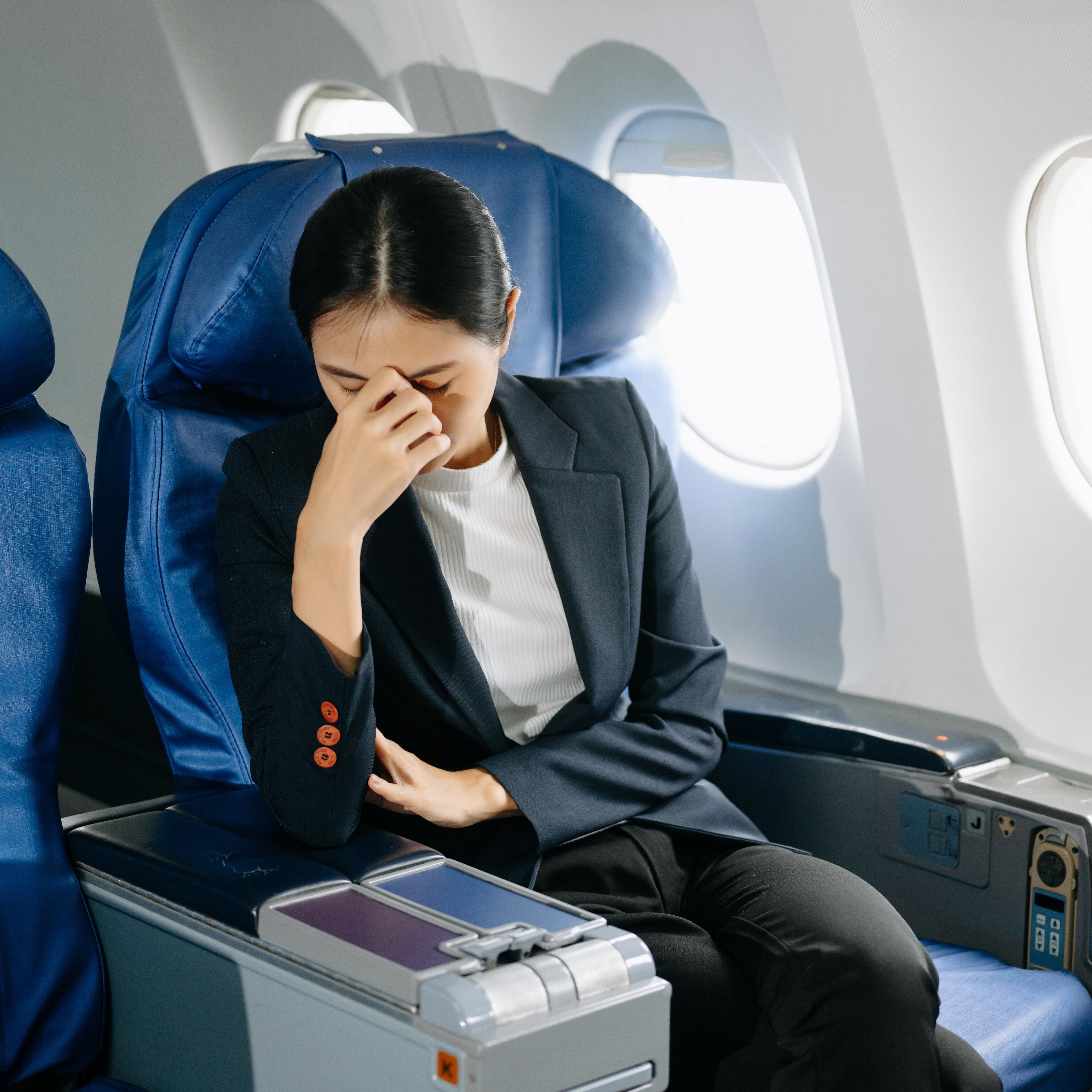 Disgruntled woman on airplane