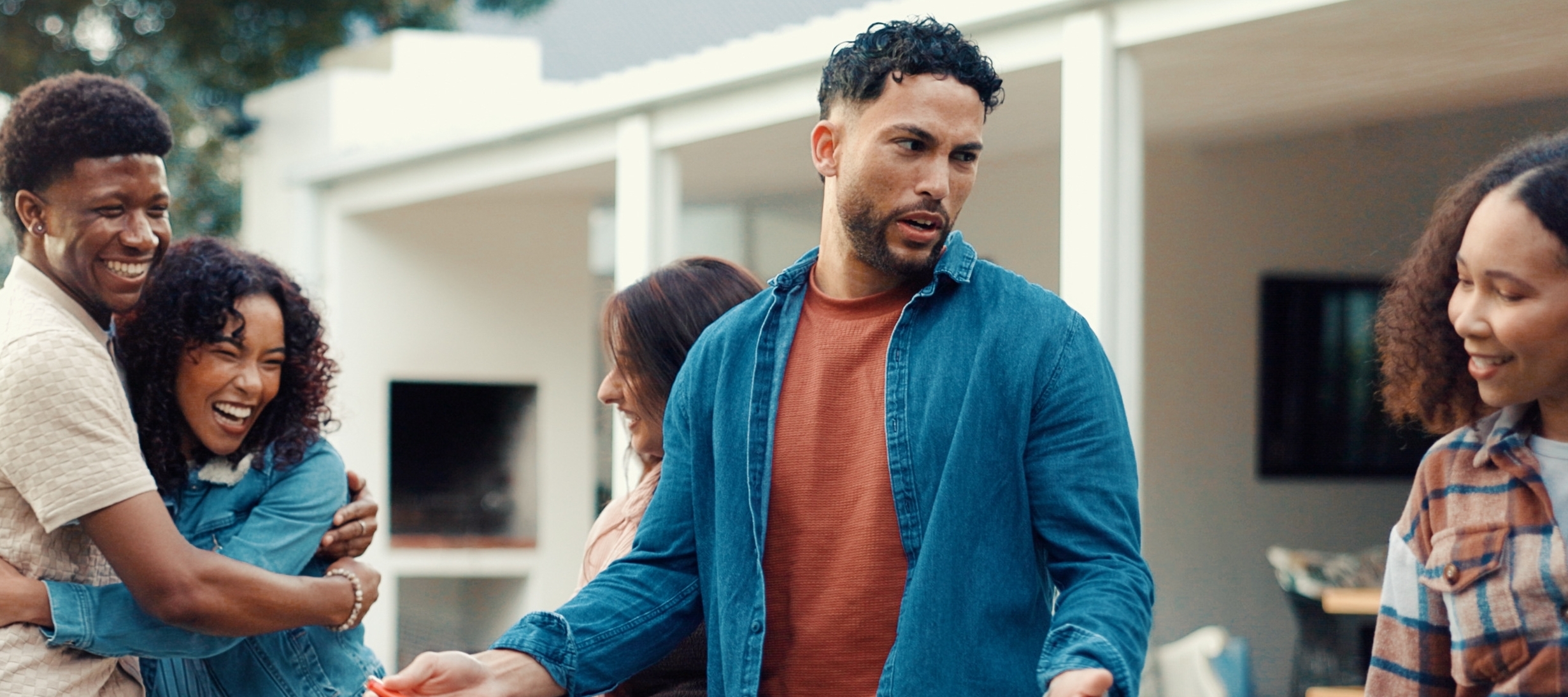 Neighbors come together for a barbecue and conversation.
