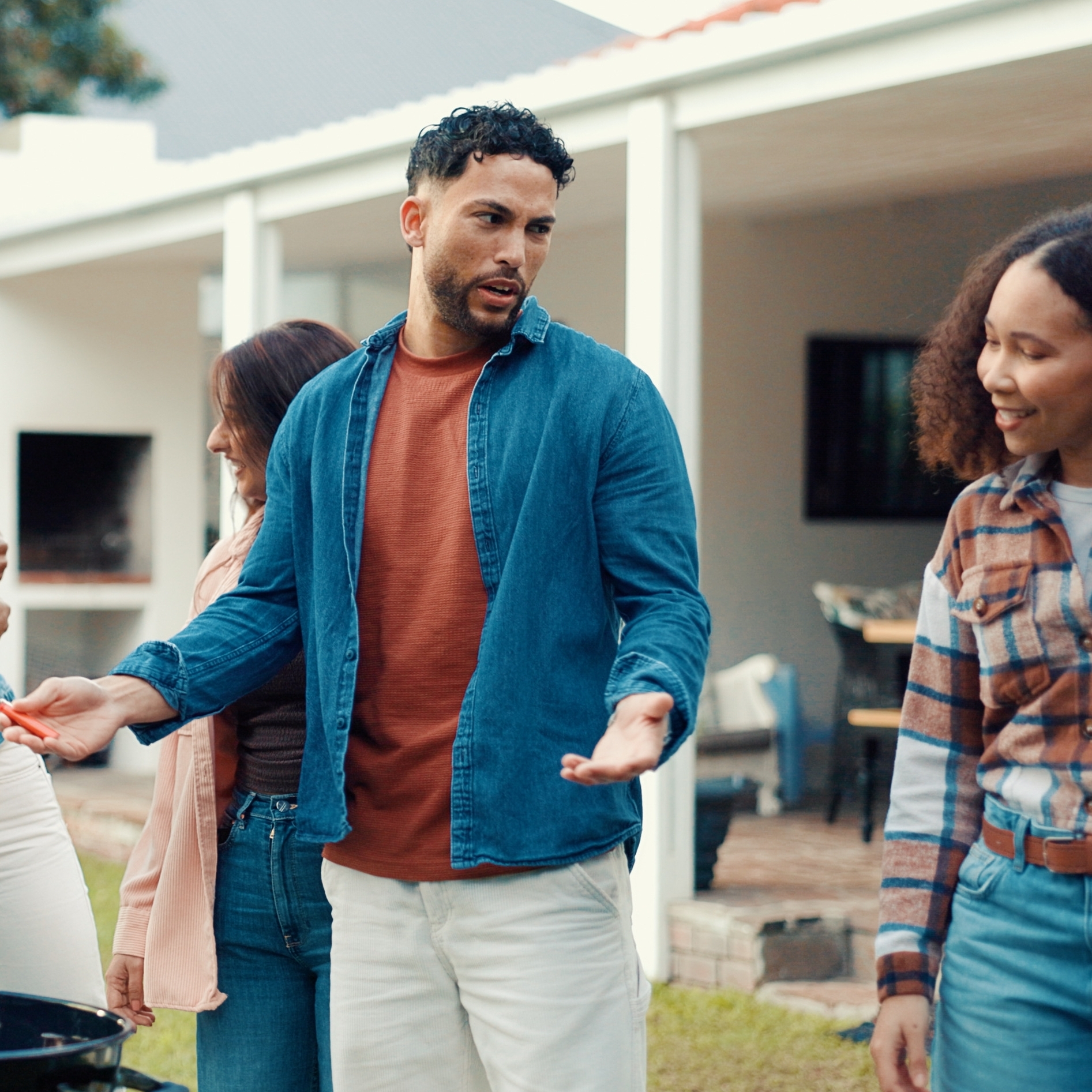 Neighbors come together for a barbecue and conversation.