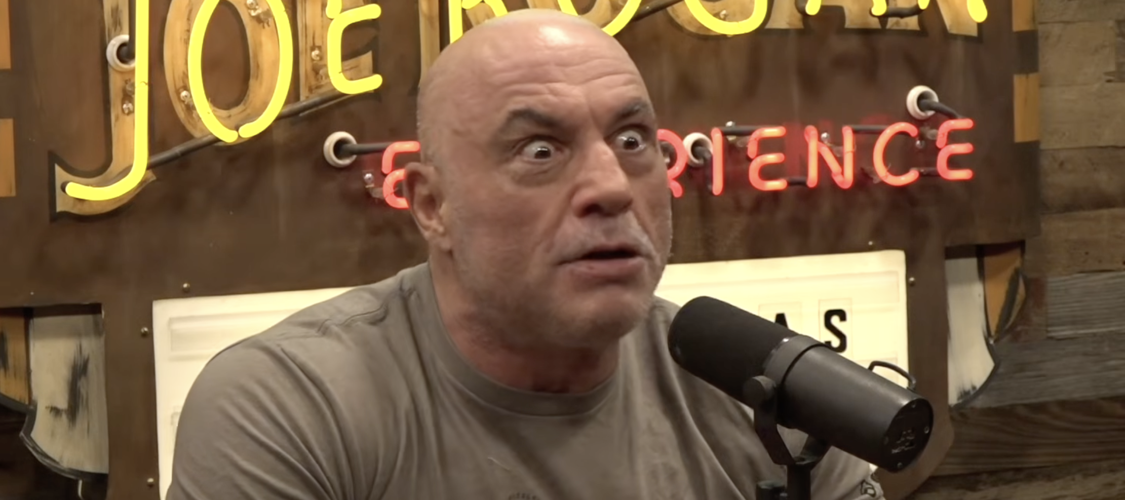 Joe Rogan reacts with wide eyes and intense shock on an episode of his hit show, The Joe Rogan Experience.