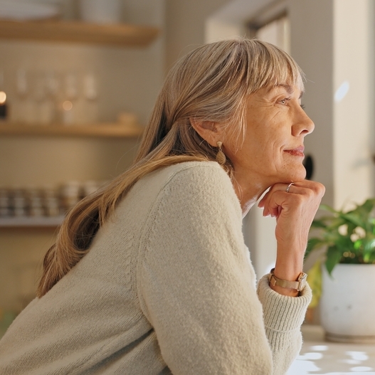 A photo of a middle-aged woman smiling
