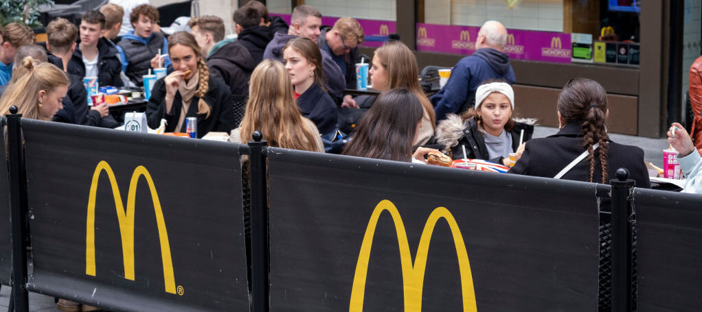Diners eat McDonald's outside of London location.