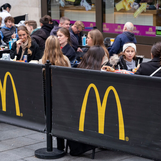 Diners eat McDonald's outside of London location.