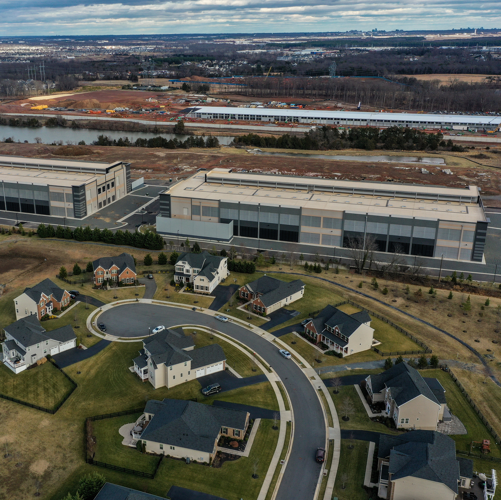 Amazon data centers have been built as close as 50 feet from residential houses in the Loudoun Meadows neighborhood in Aldie, Virginia.