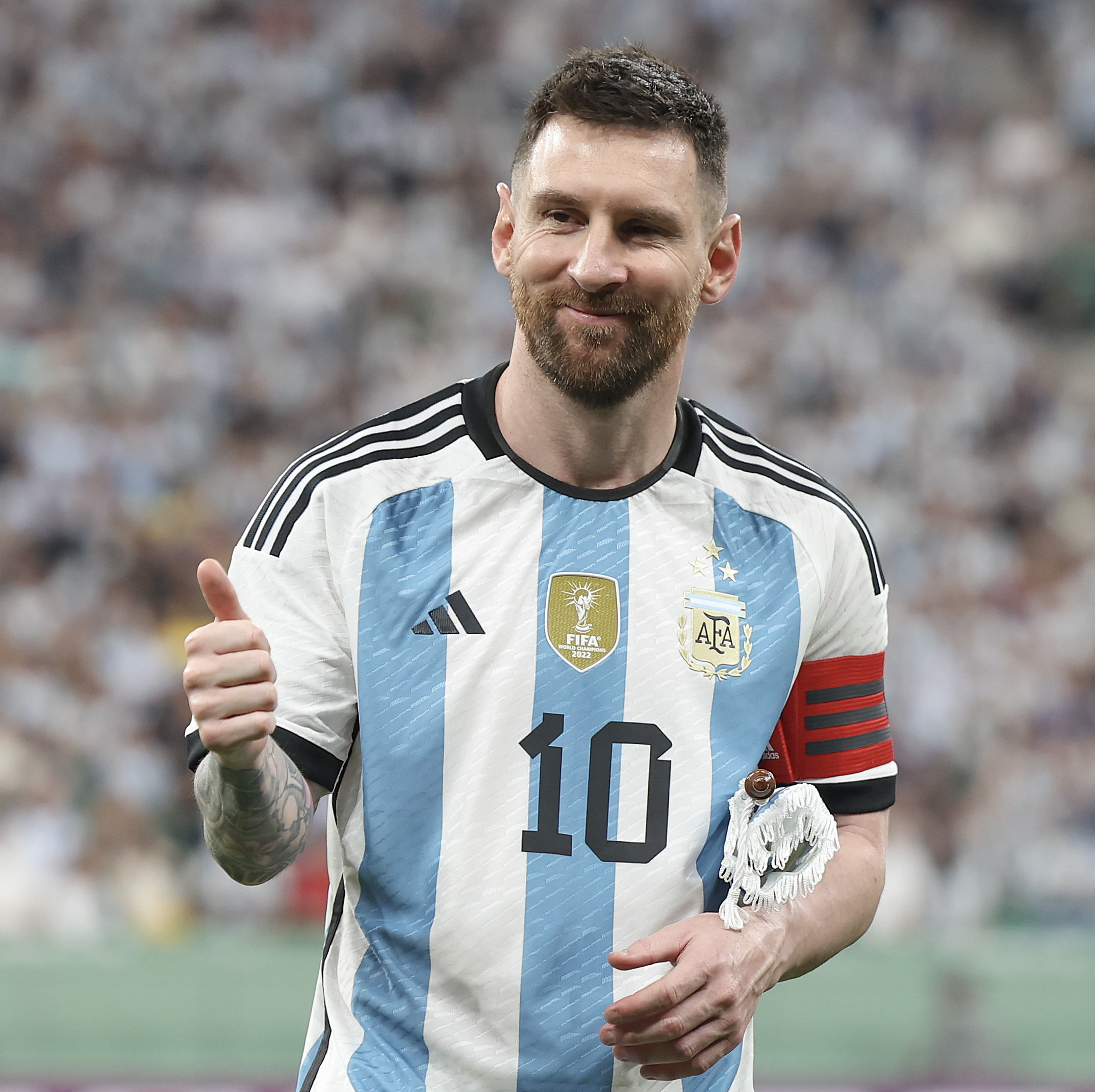 Lionel Messi gives the thumbs up at an Argentina match.