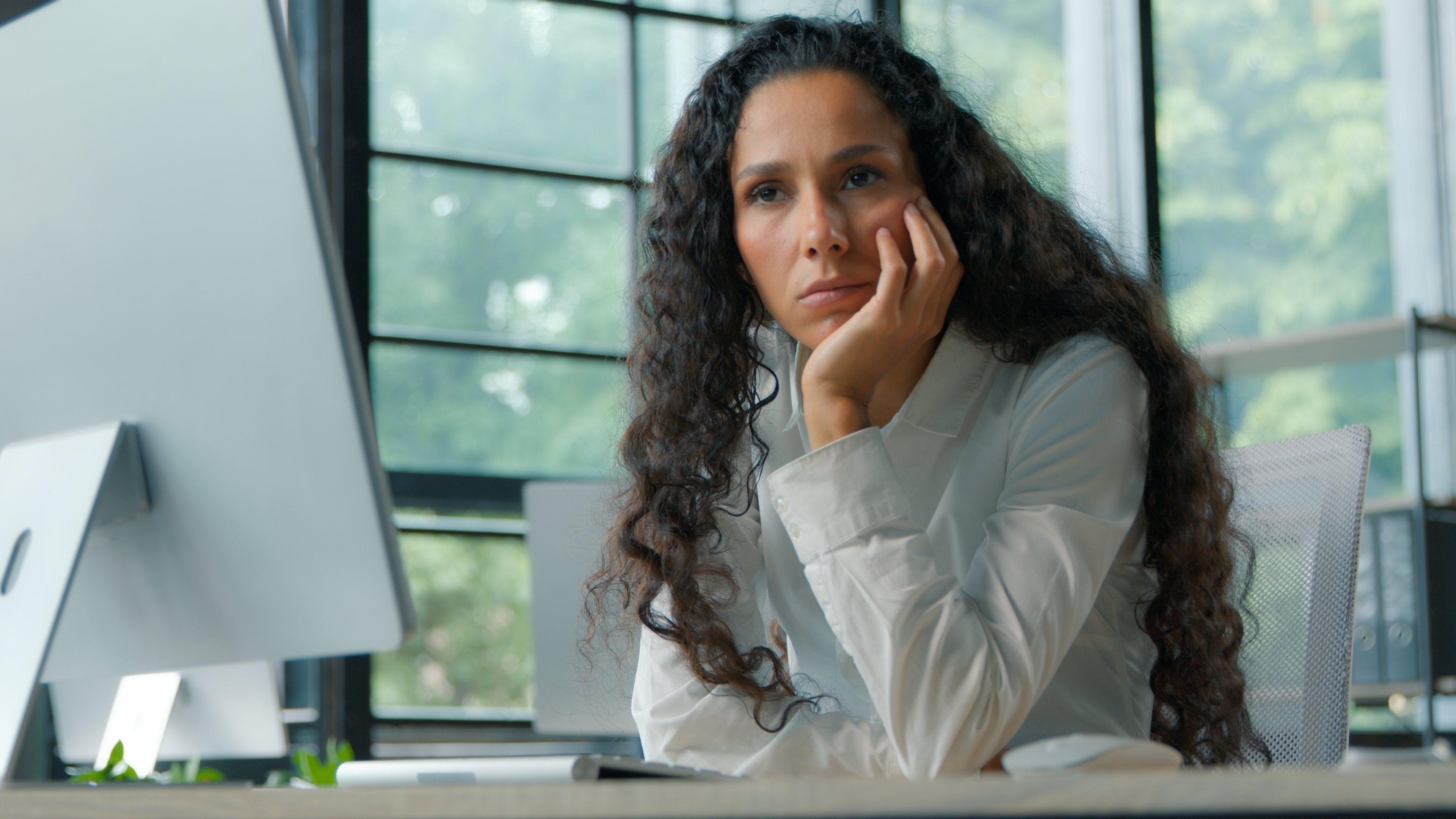 'Doomjobbing' is the career equivalent of doomscrolling — and with Americans waiting 6 months to land a job, it's a growing trap