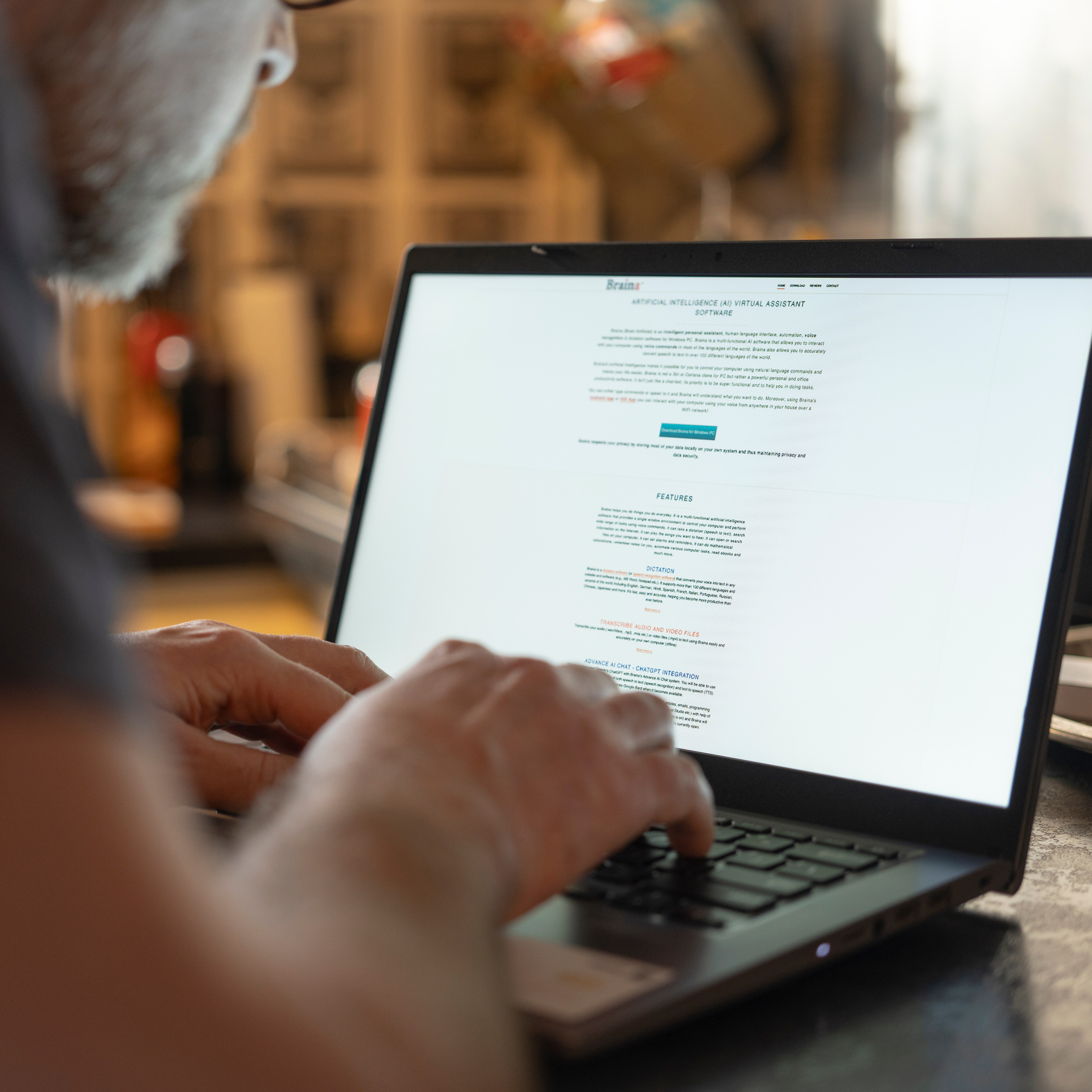 A man chats with a chatbot on his computer.