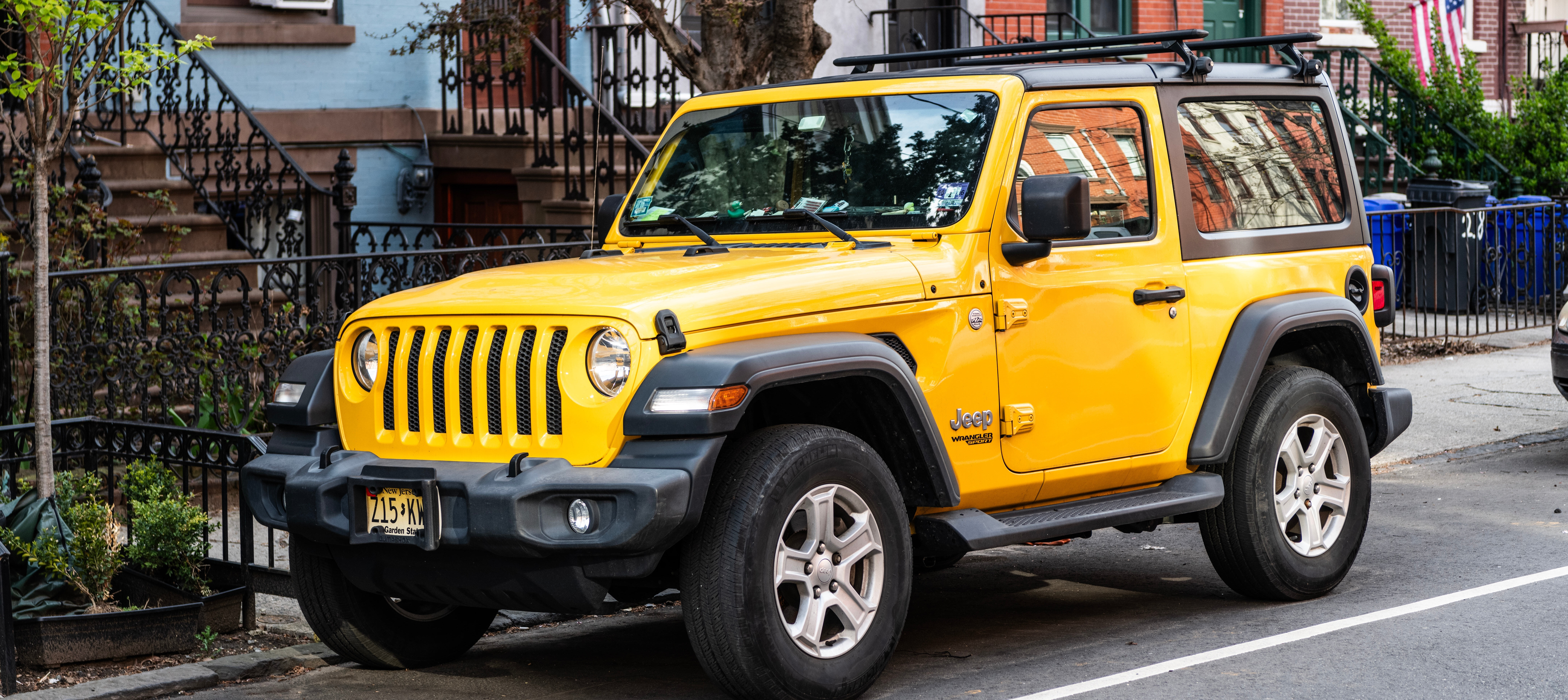 A Jeep parked outside of a home.